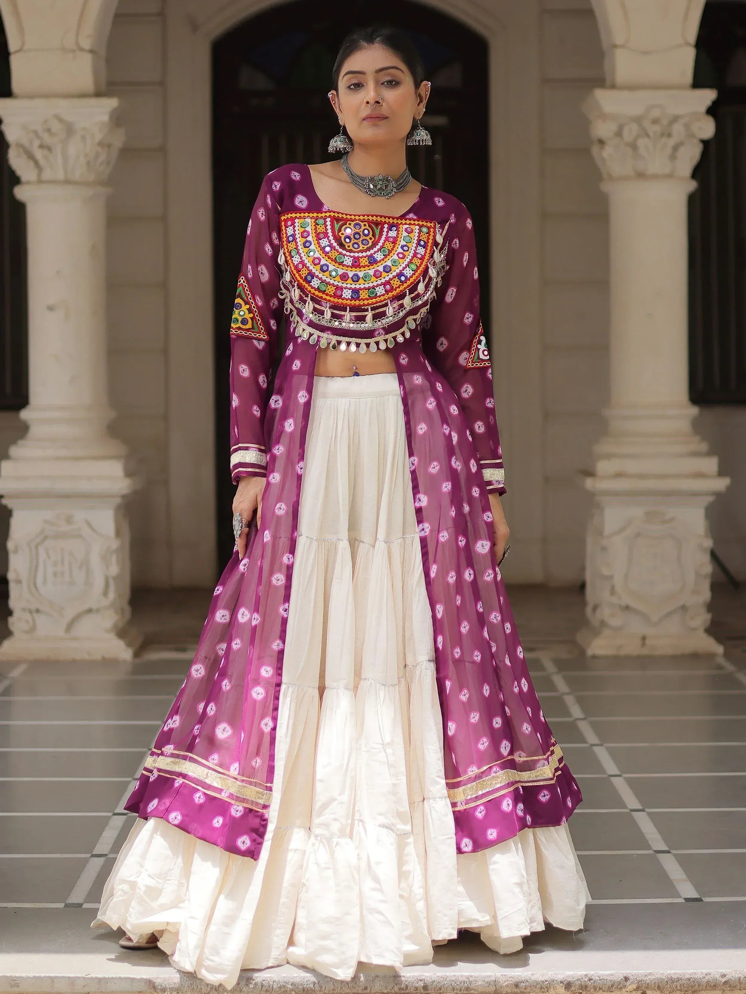 Purple embroidered Indian ethnic wear with white tiered skirt, perfect for festive occasions