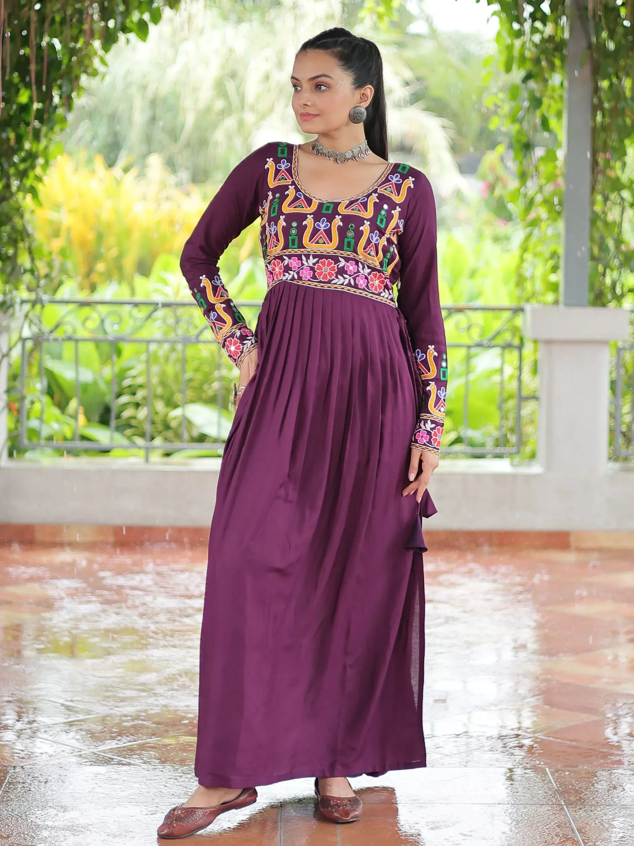 Purple ethnic gown with floral embroidery, perfect for Indian wear trends