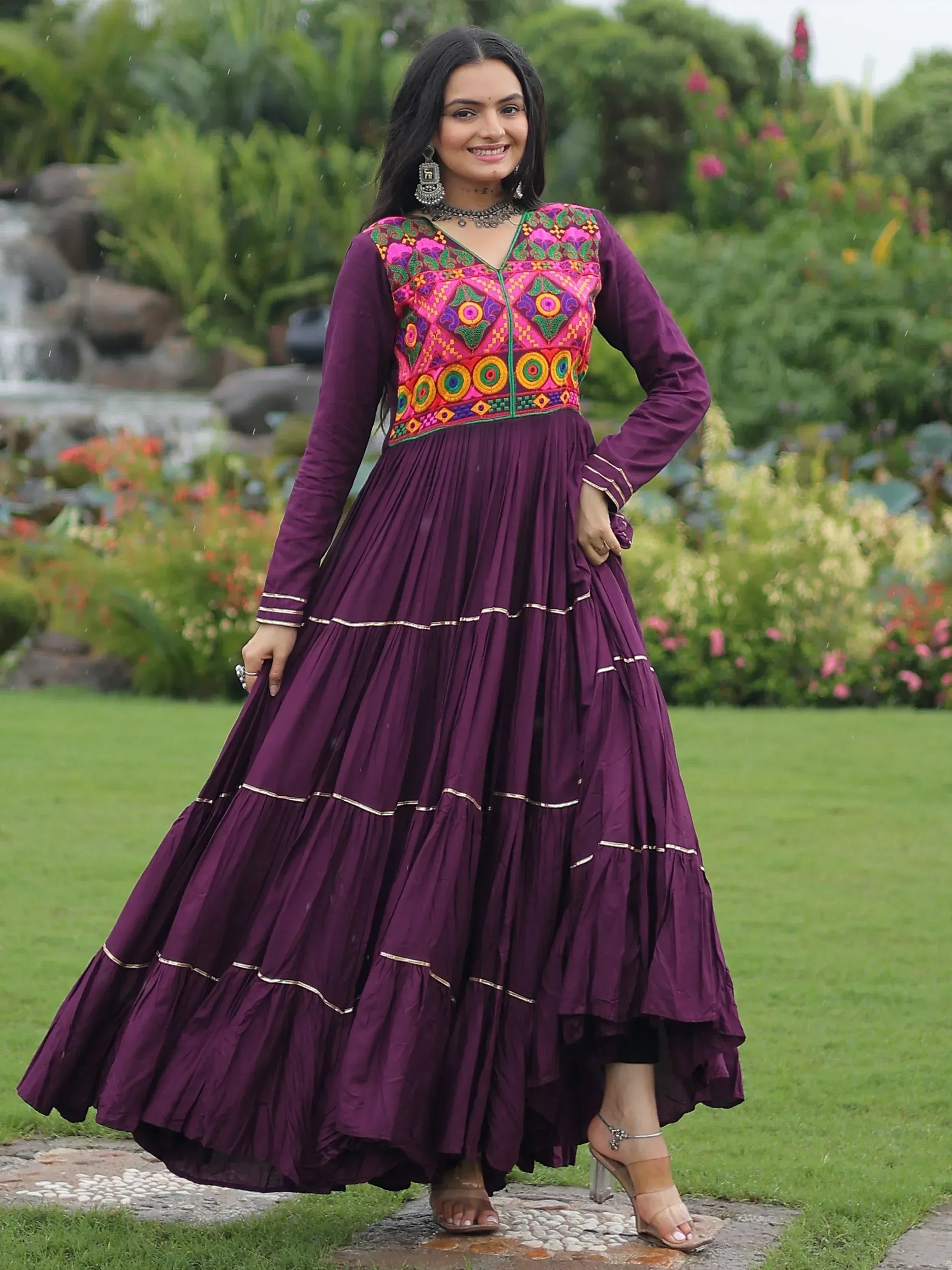 Purple ethnic gown with vibrant embroidered bodice, perfect for Indian festive wear