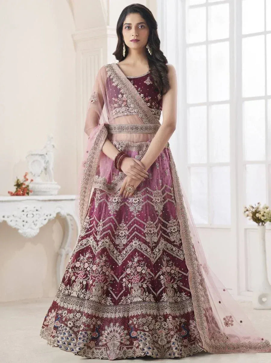 Maroon embroidered lehenga choli with peacock motifs and sheer dupatta, ideal for Indian weddings and festive occasions