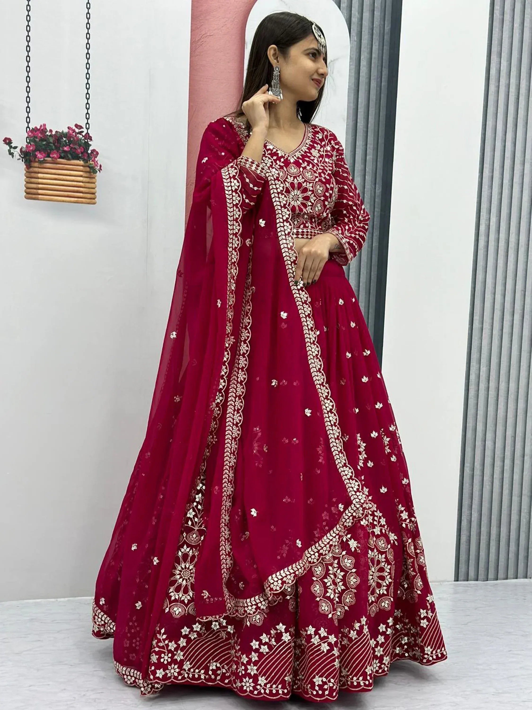 Elegant maroon lehenga choli with intricate white embroidery, perfect for Indian ethnic wear occasions.
