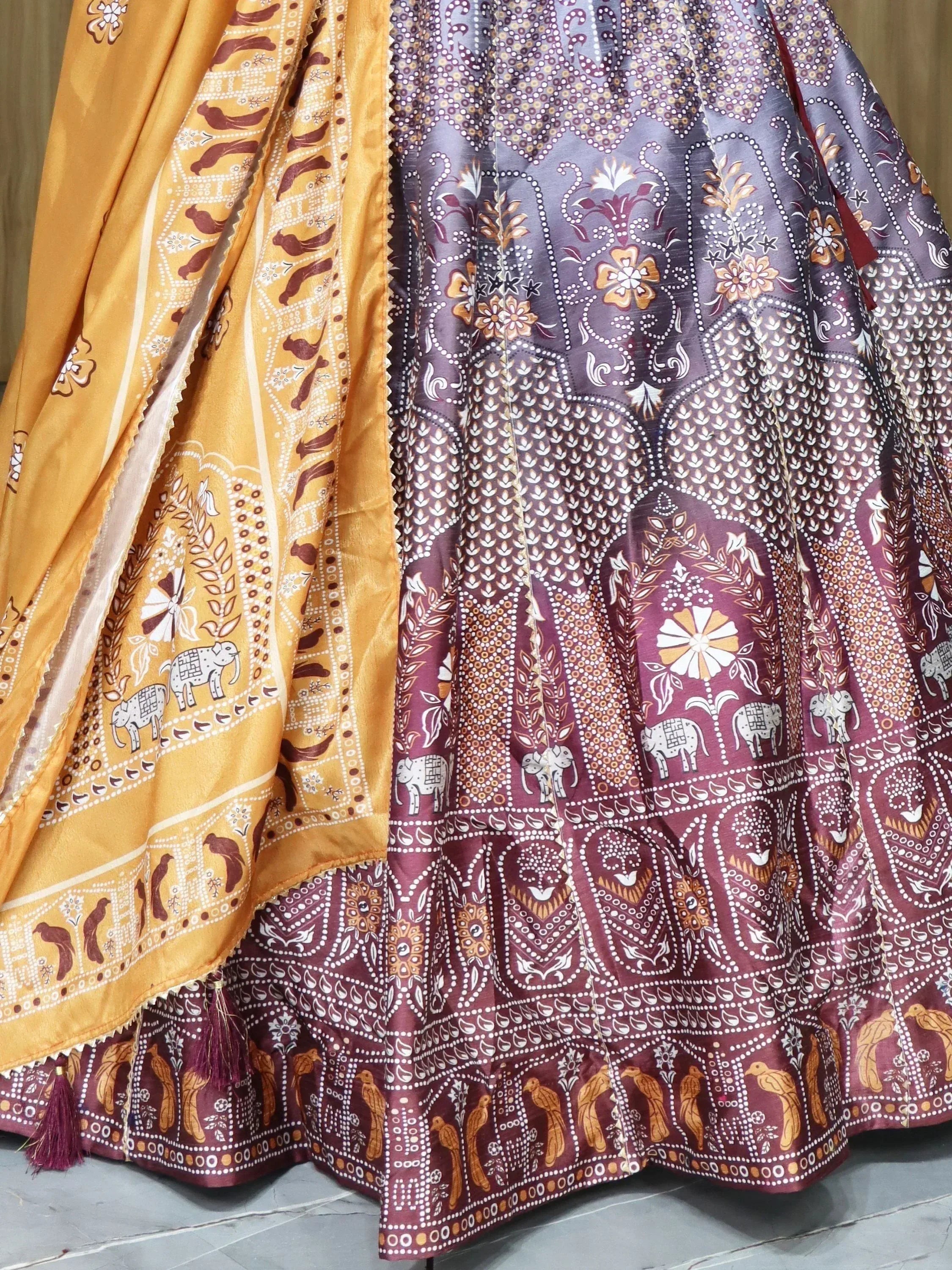 Ethnic print lehenga with mustard and maroon panels, elephant motifs, and tassels
