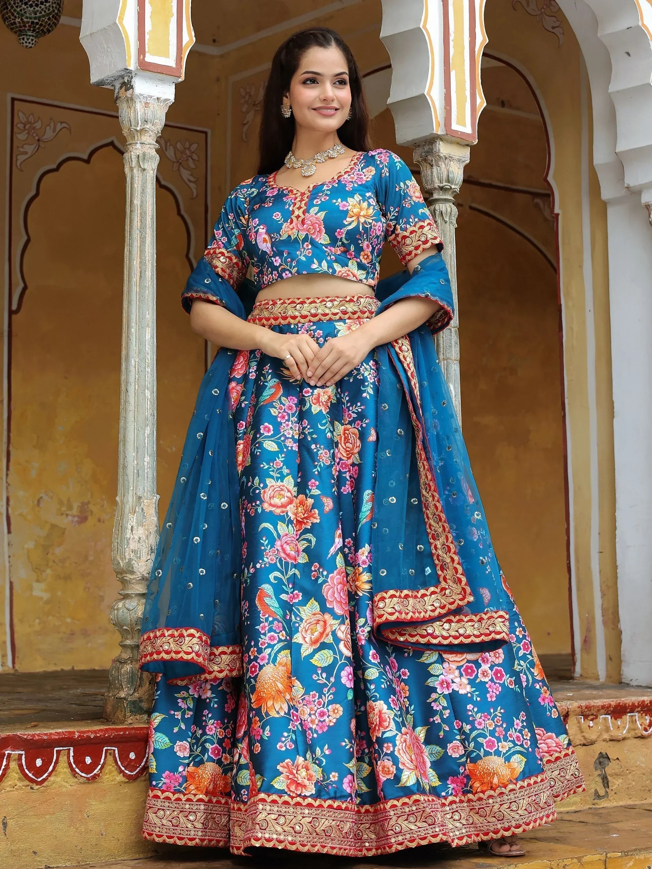 Blue floral print lehenga choli with gold embroidery, perfect for Indian ethnic occasions