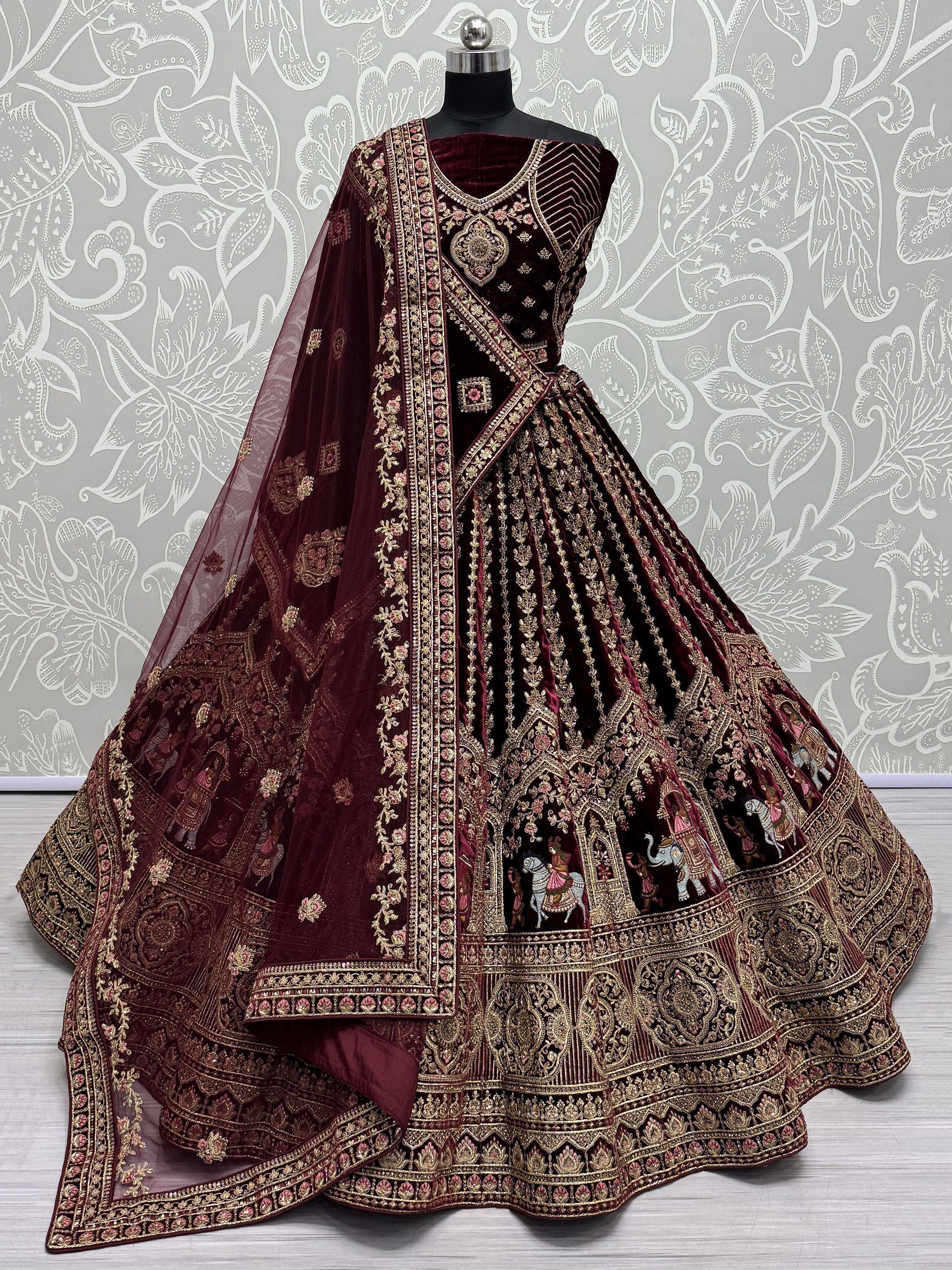Maroon velvet designer lehenga with gold embroidery and sheer dupatta for Indian ethnic wear