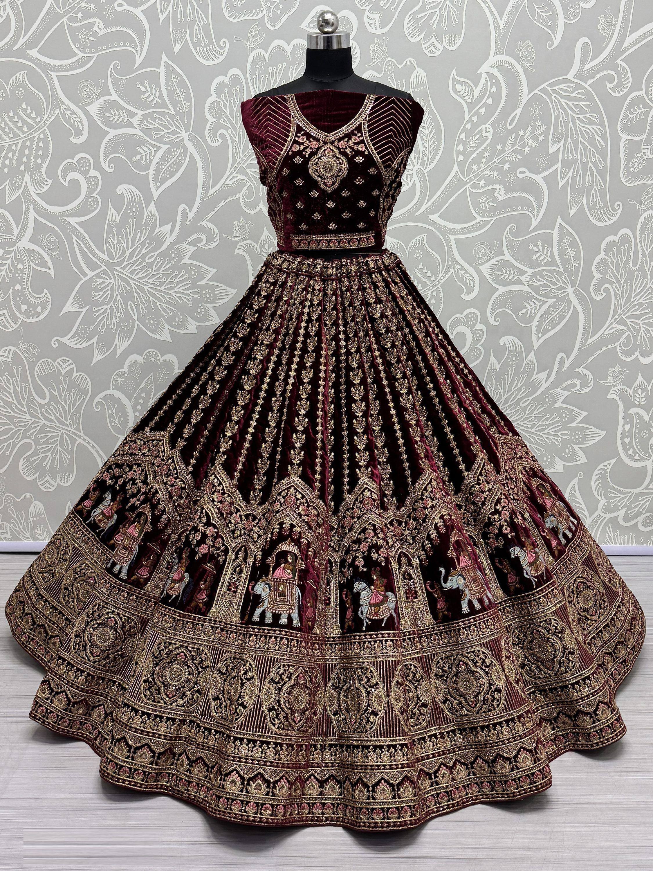 Maroon velvet lehenga choli with intricate gold embroidery and royal motifs for festive occasions