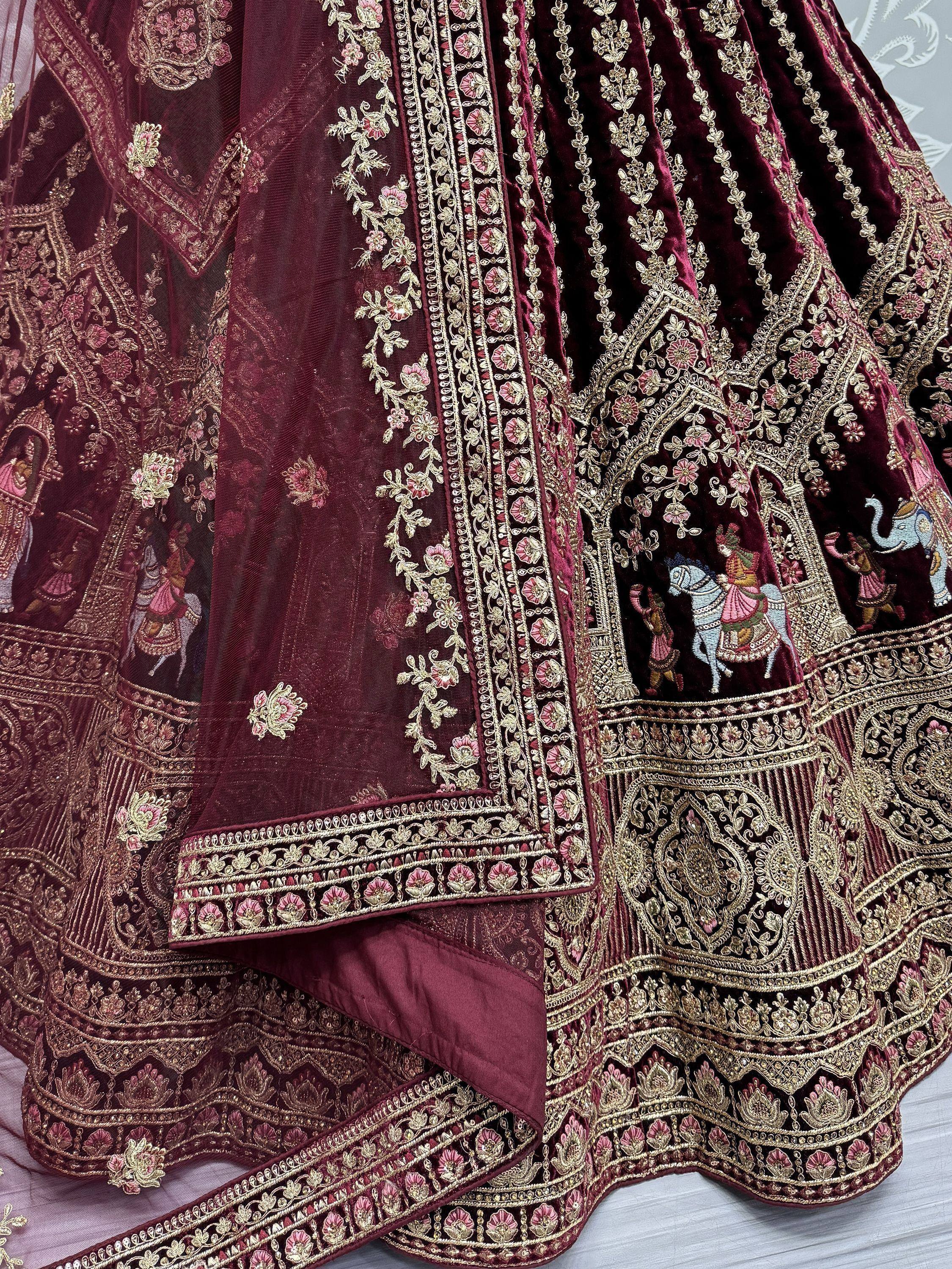 Maroon velvet lehenga with gold embroidery and floral motifs, perfect for Indian ethnic wear.