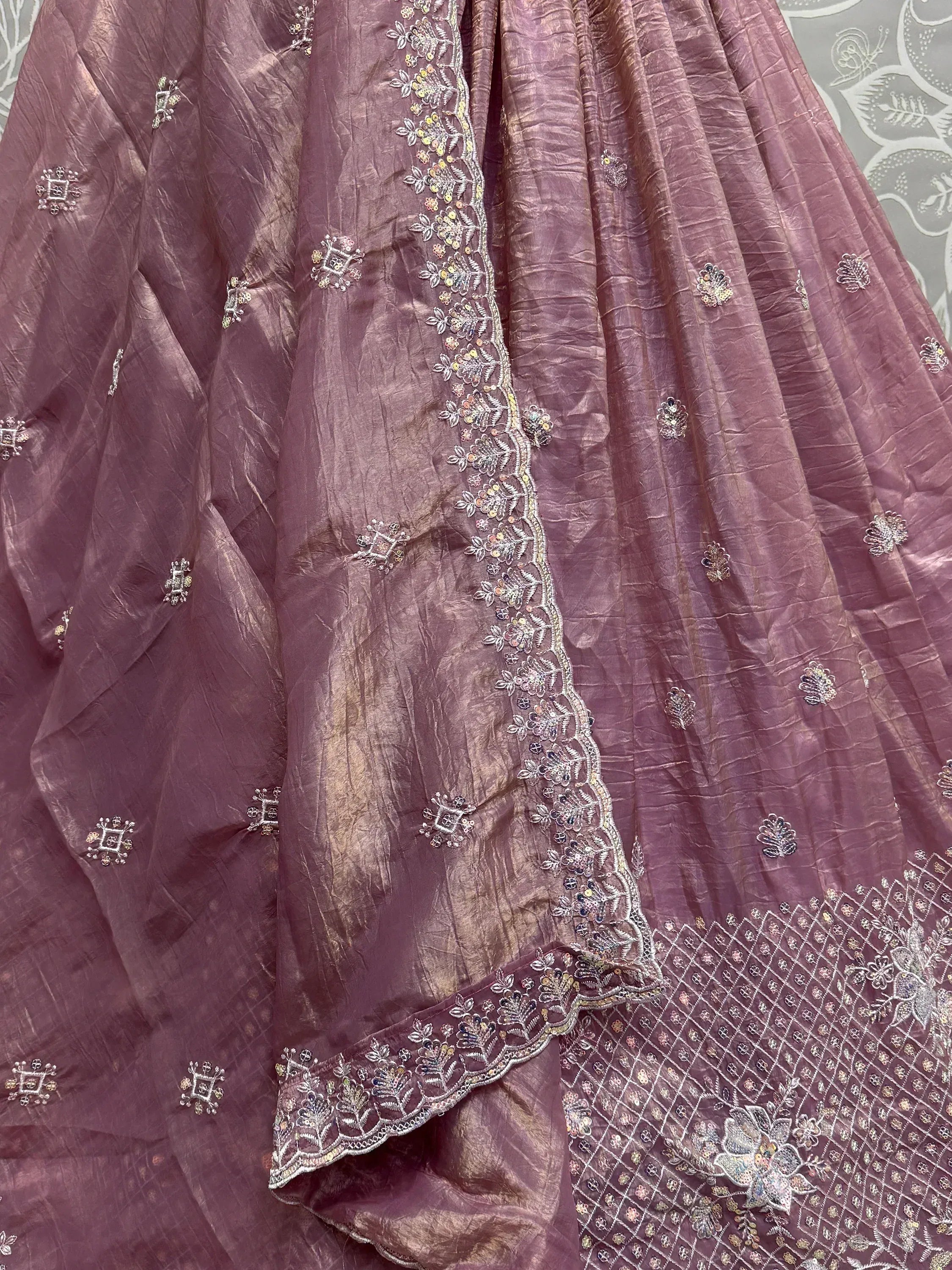 Mauve ethnic lehenga with floral embroidery and sequin detailing, perfect for Indian weddings and festive occasions.
