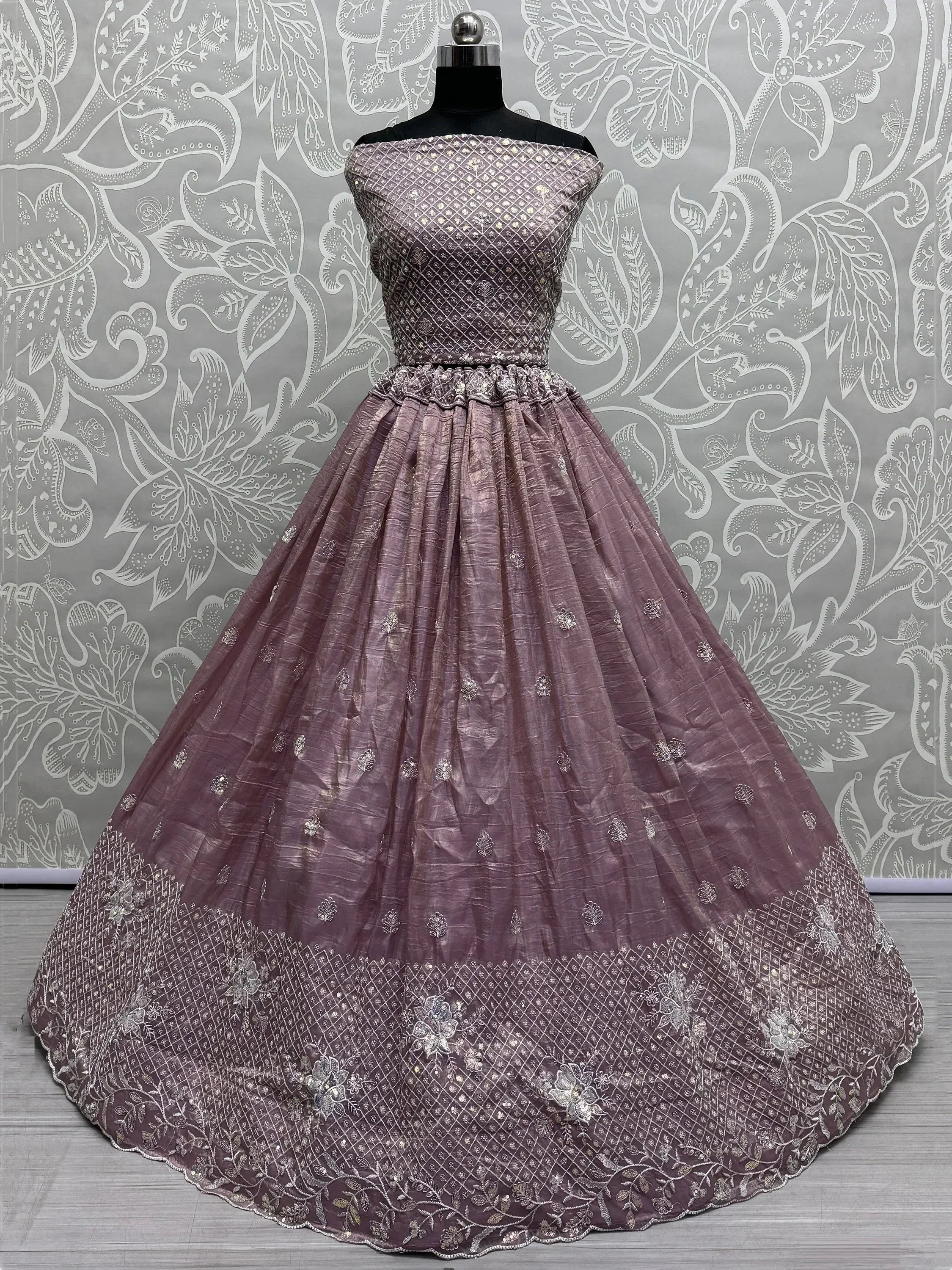 Mauve ethnic gown with silver embroidery, off-shoulder design, perfect for Indian weddings and parties.