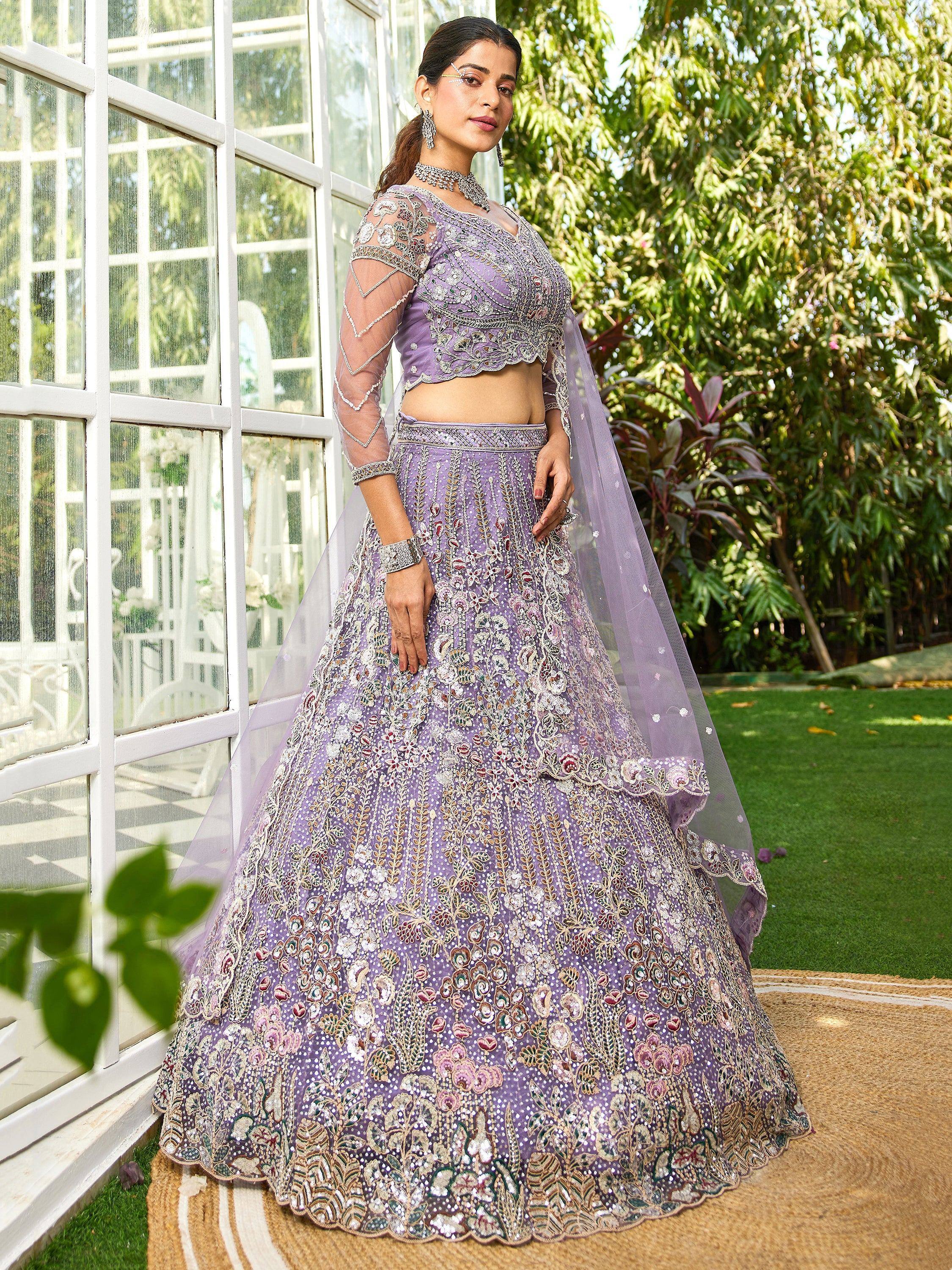 Lavender embroidered lehenga choli with sheer sleeves and floral detailing, perfect for Indian weddings and events.