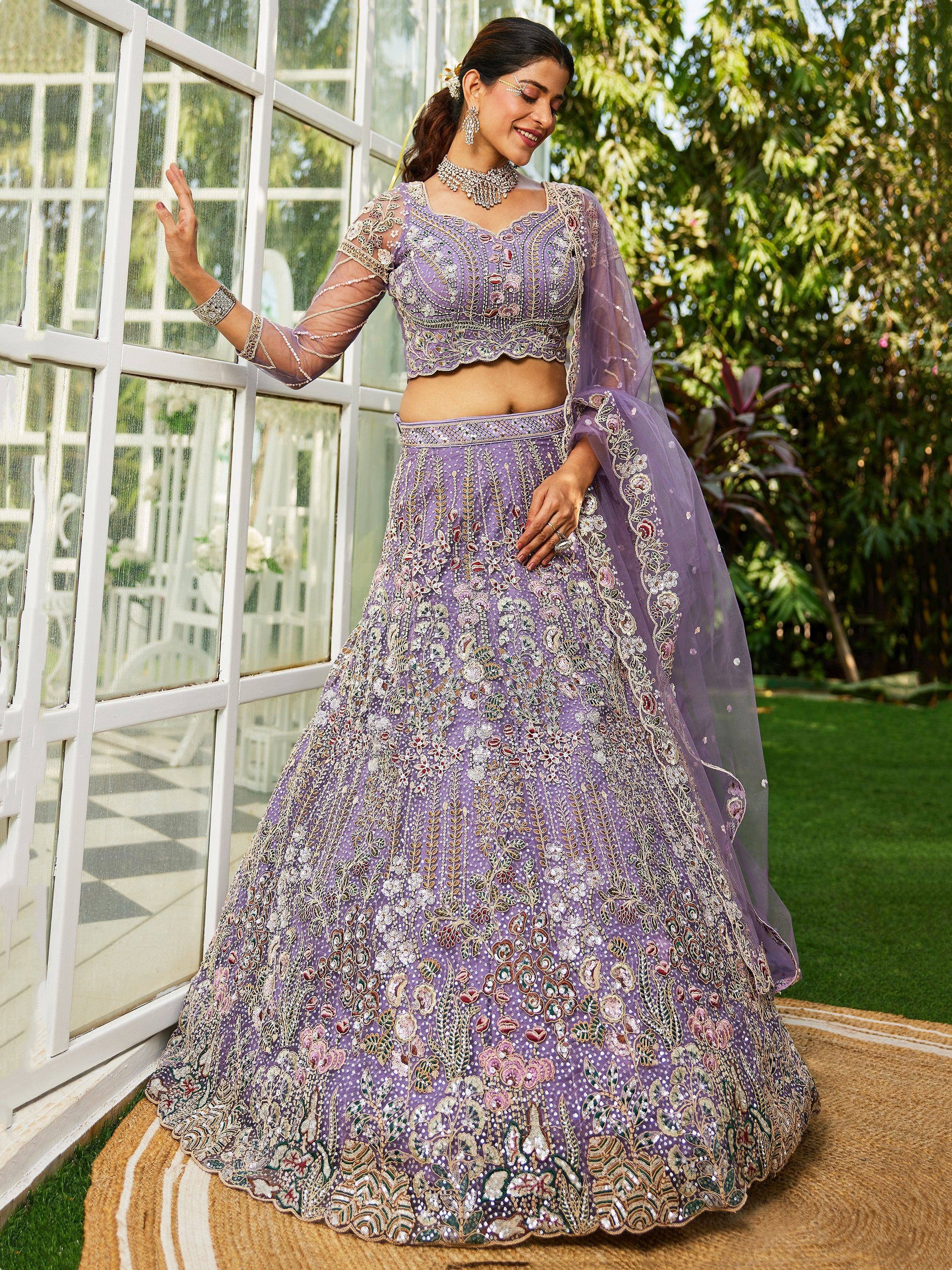 Purple embroidered lehenga choli with floral motifs, sheer sleeves, and matching dupatta for Indian ethnic wear