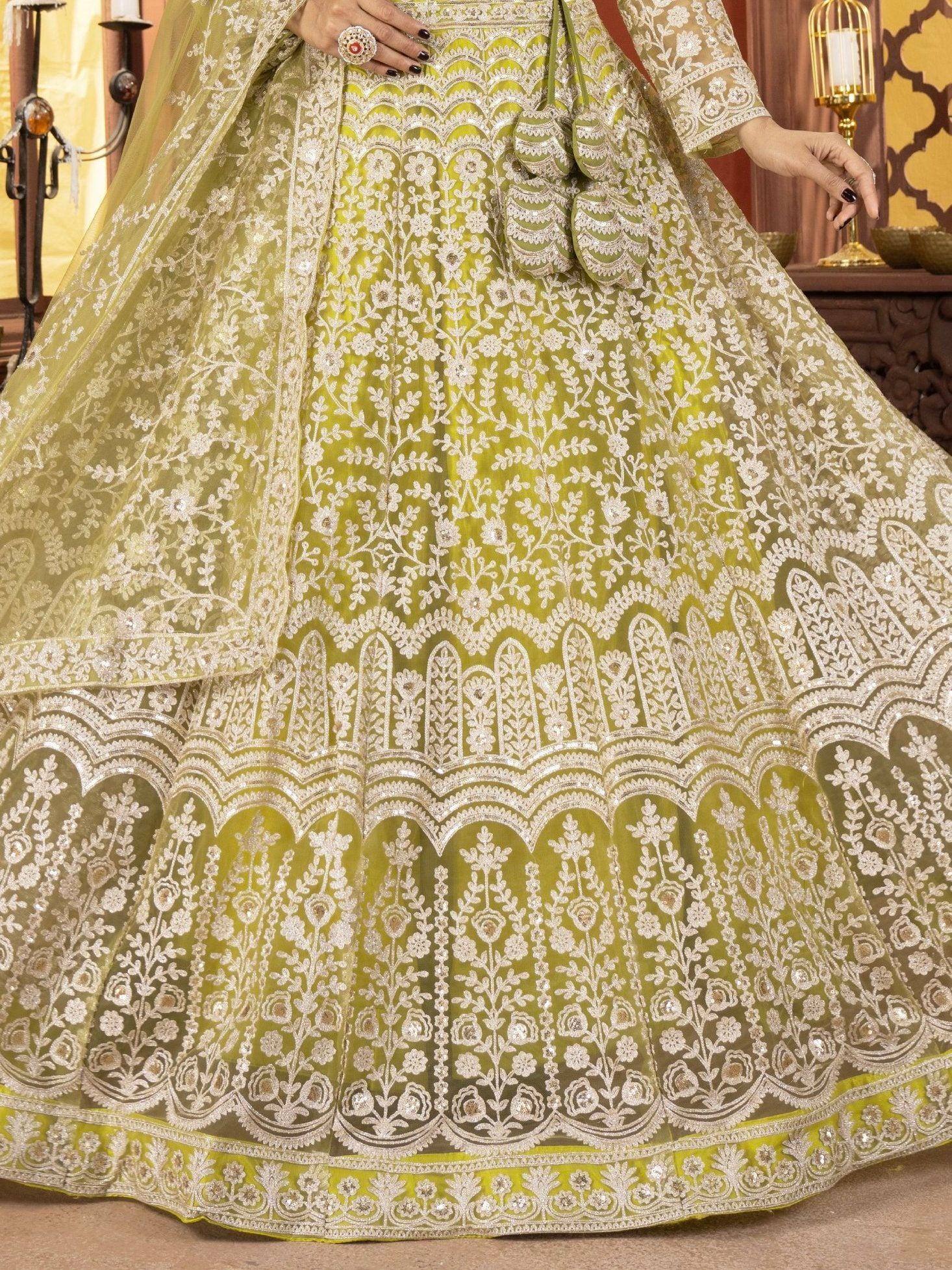 Lime green designer lehenga choli with intricate white embroidery and sequin detailing for Indian ethnic wear