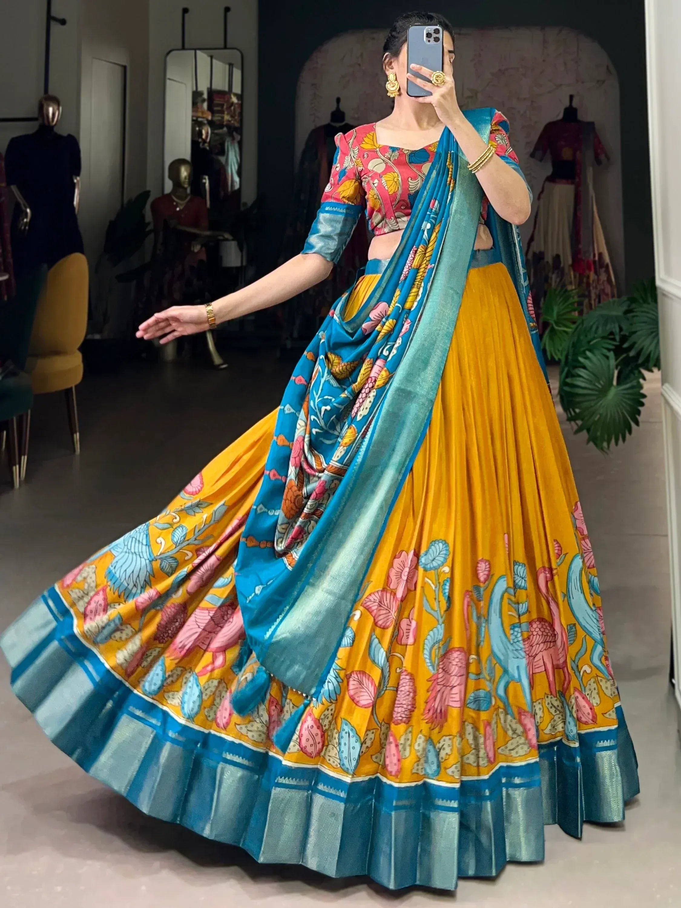 Vibrant yellow and blue printed lehenga choli with floral motifs, perfect for Indian ethnic wear occasions.