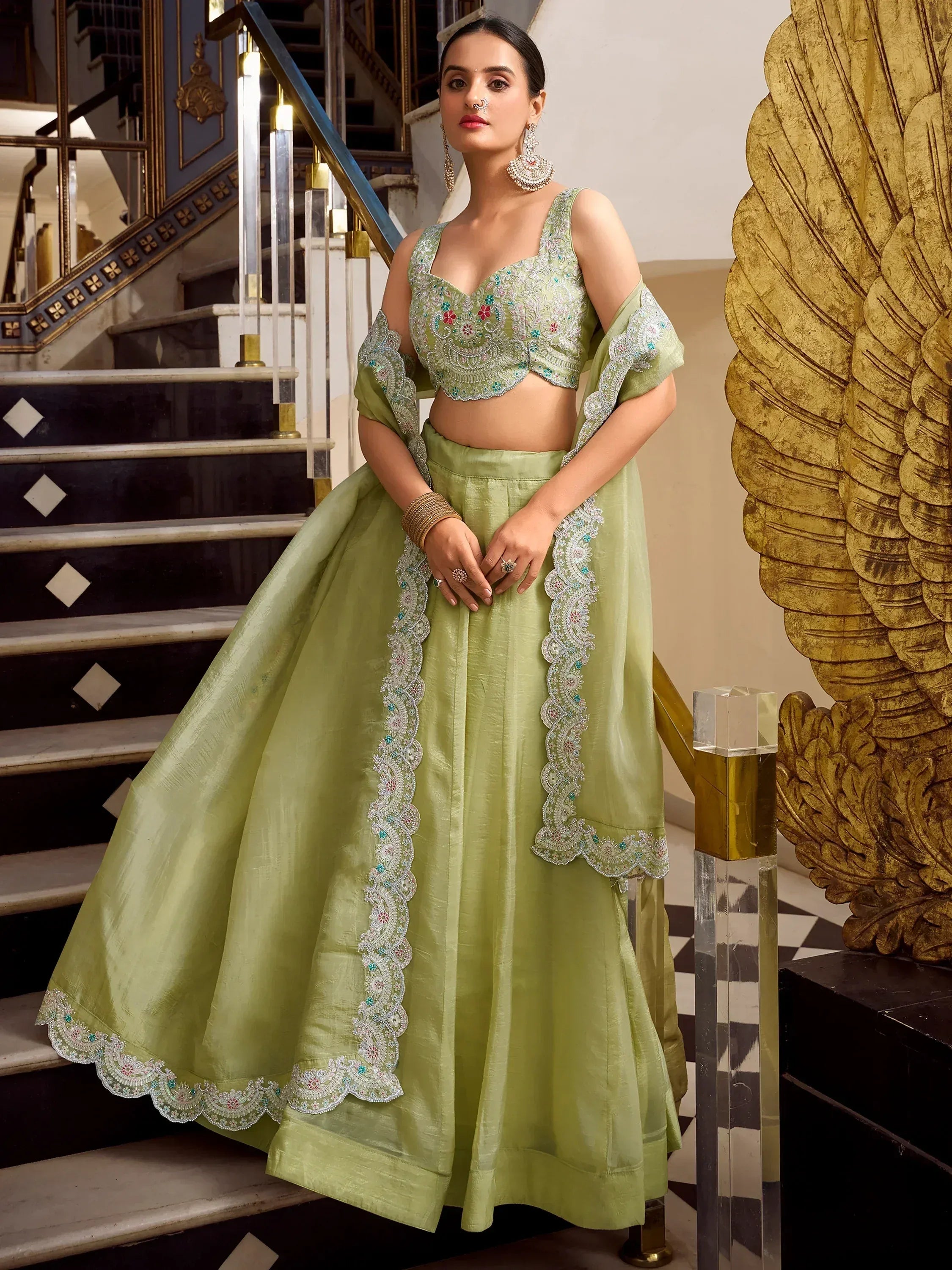 Light green embroidered lehenga choli with floral detailing, perfect for Indian ethnic wear events