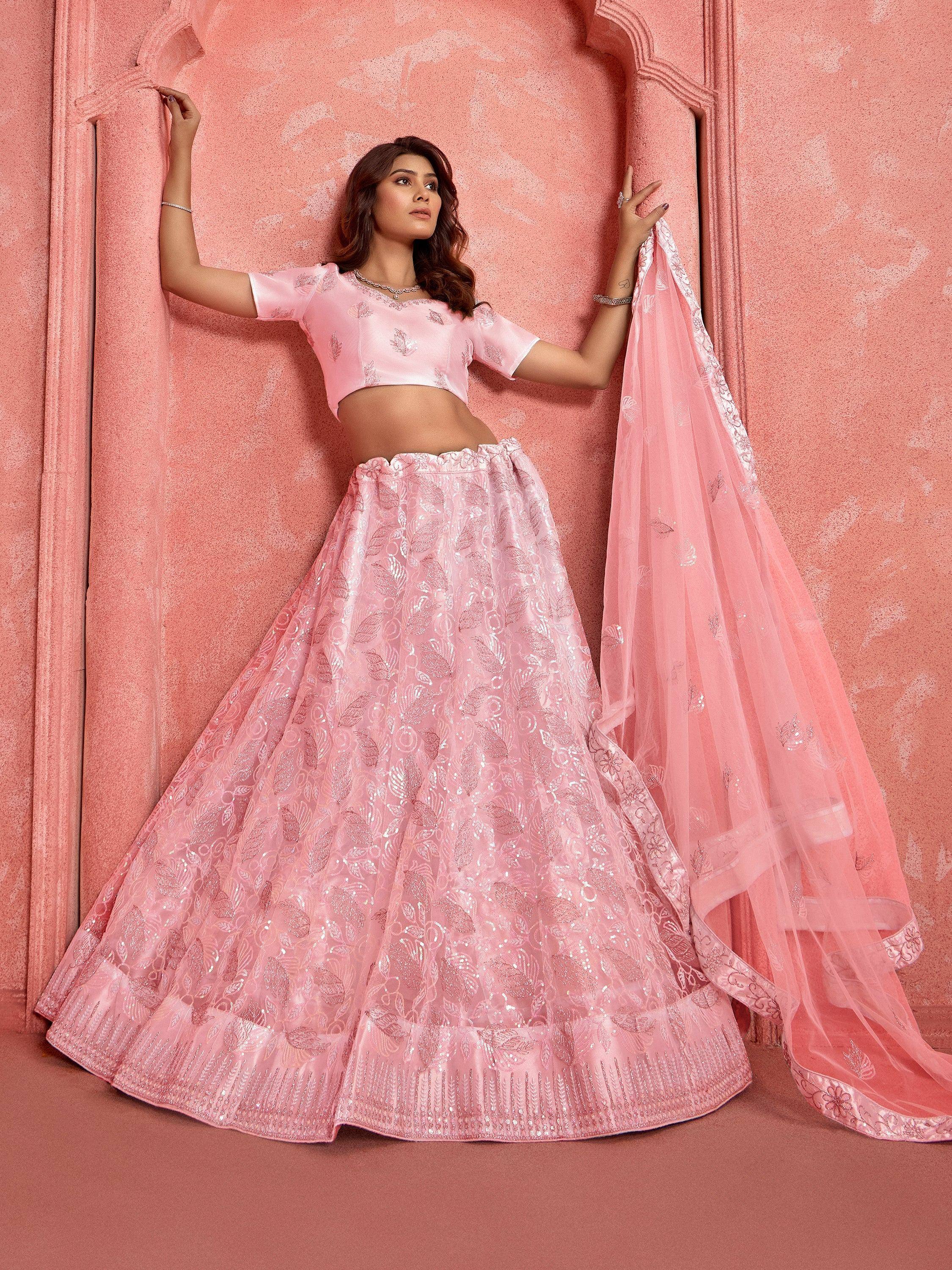 Pink designer lehenga choli with sequin embroidery, perfect for Indian weddings and festive occasions.