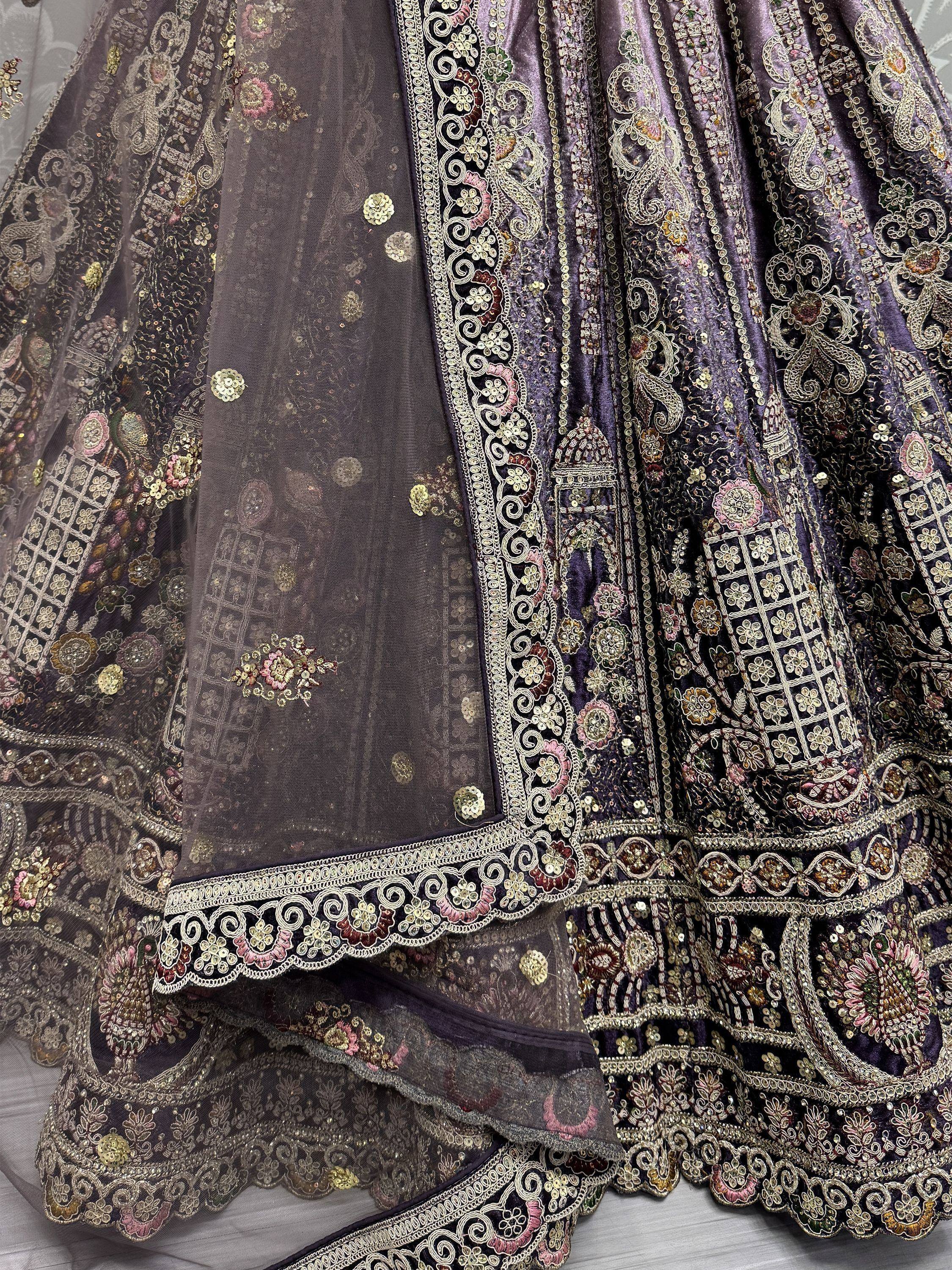 Purple velvet lehenga with heavy gold embroidery and floral sequin work, perfect for Indian weddings.