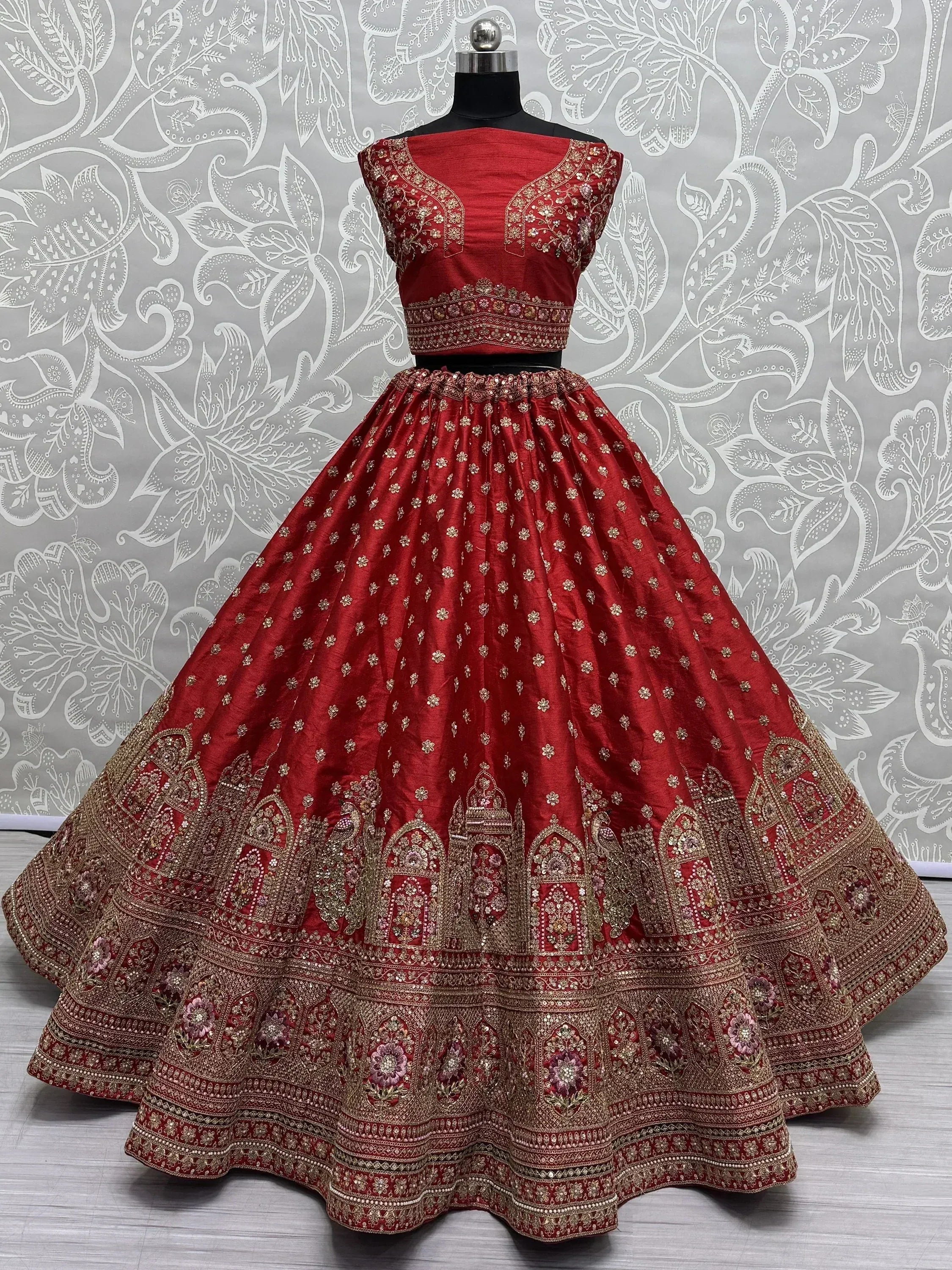 Red embroidered lehenga choli with gold detailing, perfect for Indian ethnic wear and festive occasions
