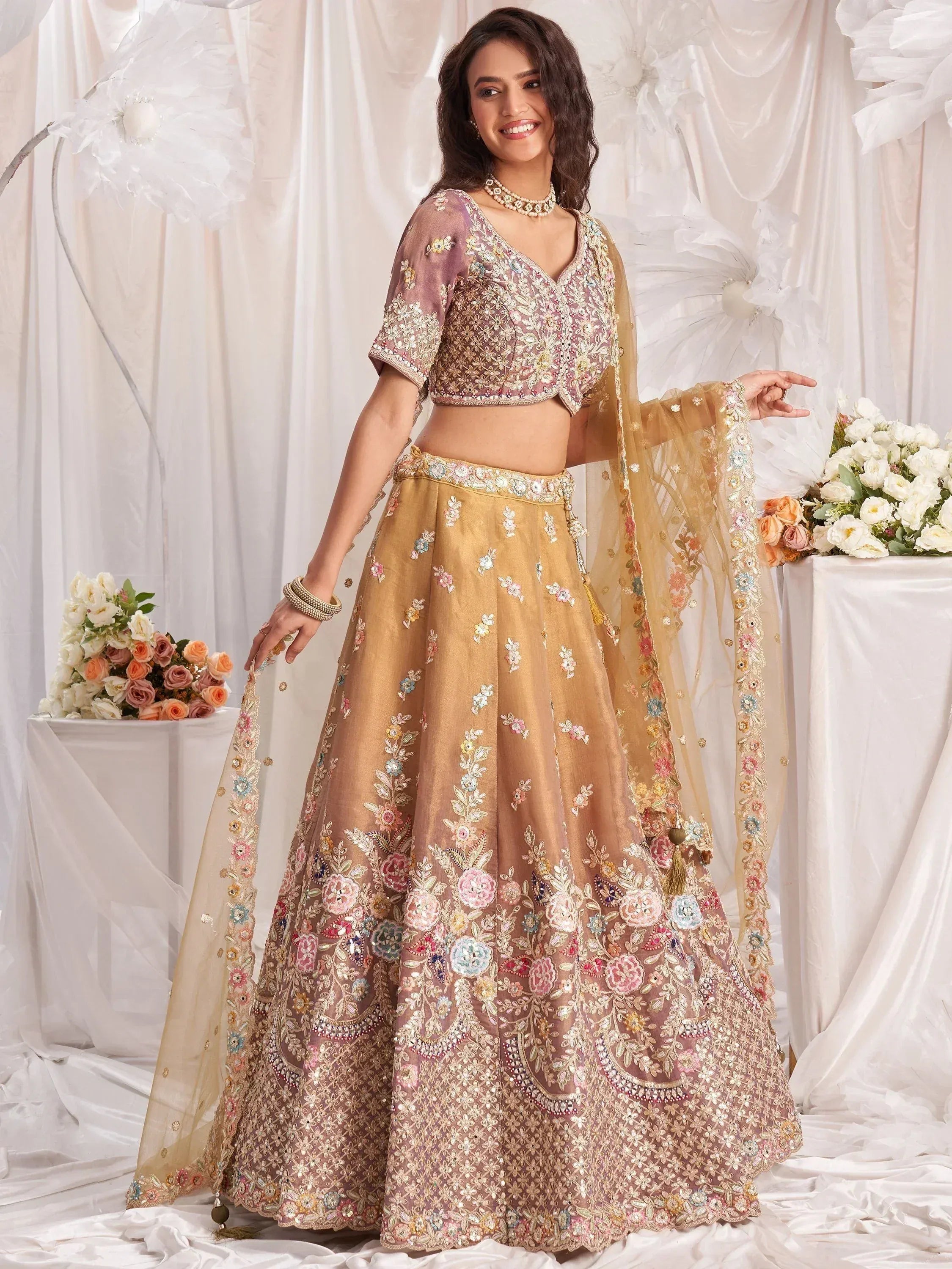 Elegant floral embroidered lehenga choli with sheer dupatta, perfect for Indian weddings and festive occasions