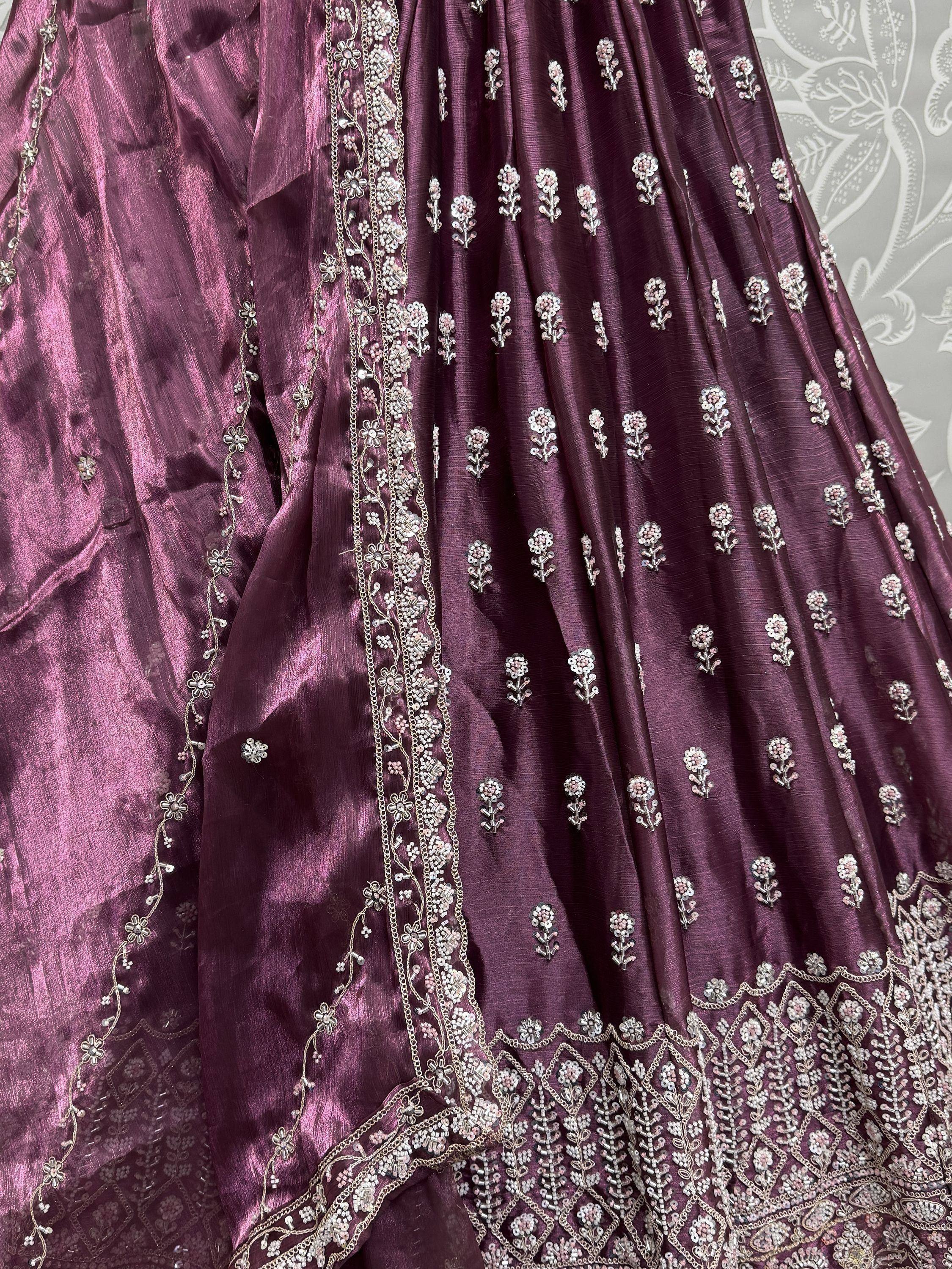 Elegant maroon ethnic gown with floral embroidery and intricate detailing