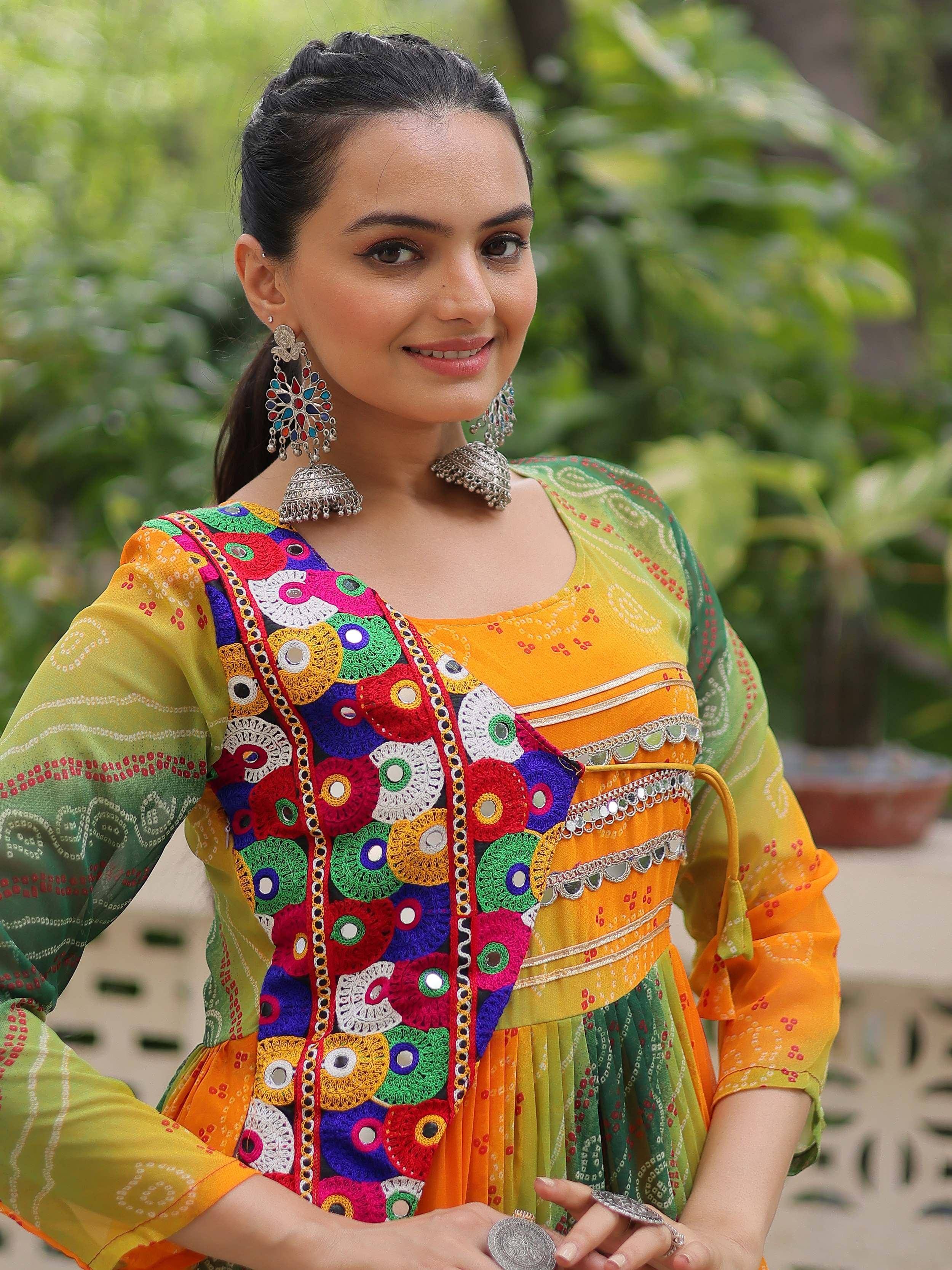 Colorful Indian ethnic dress with mirror work, embroidery, and traditional jewelry for women