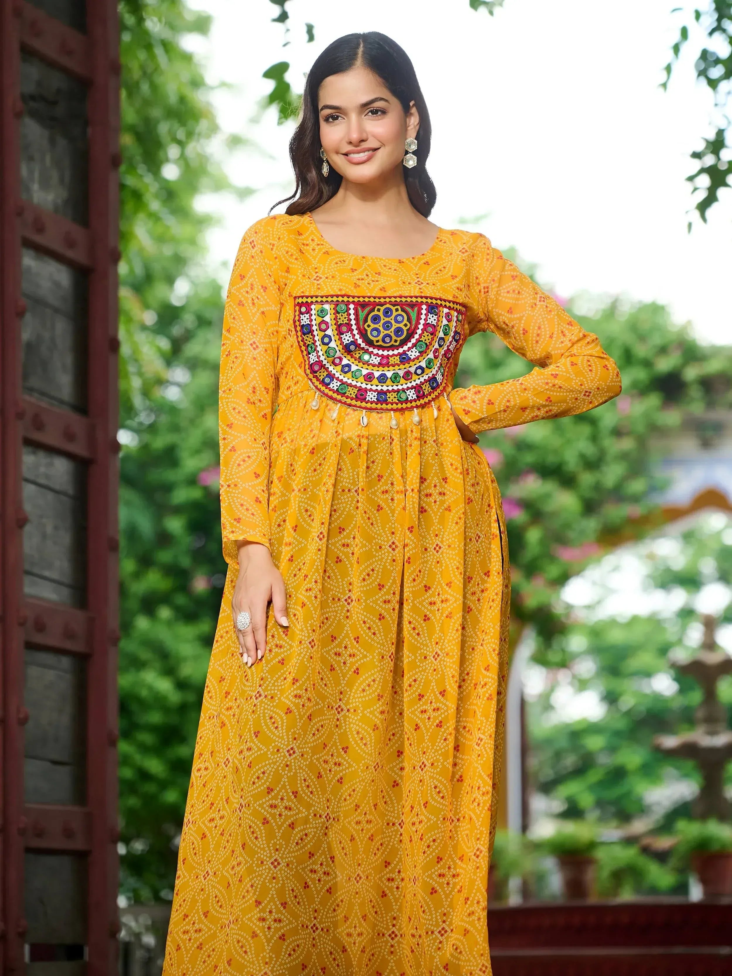 Yellow ethnic gown with colorful embroidery and floral patterns for women