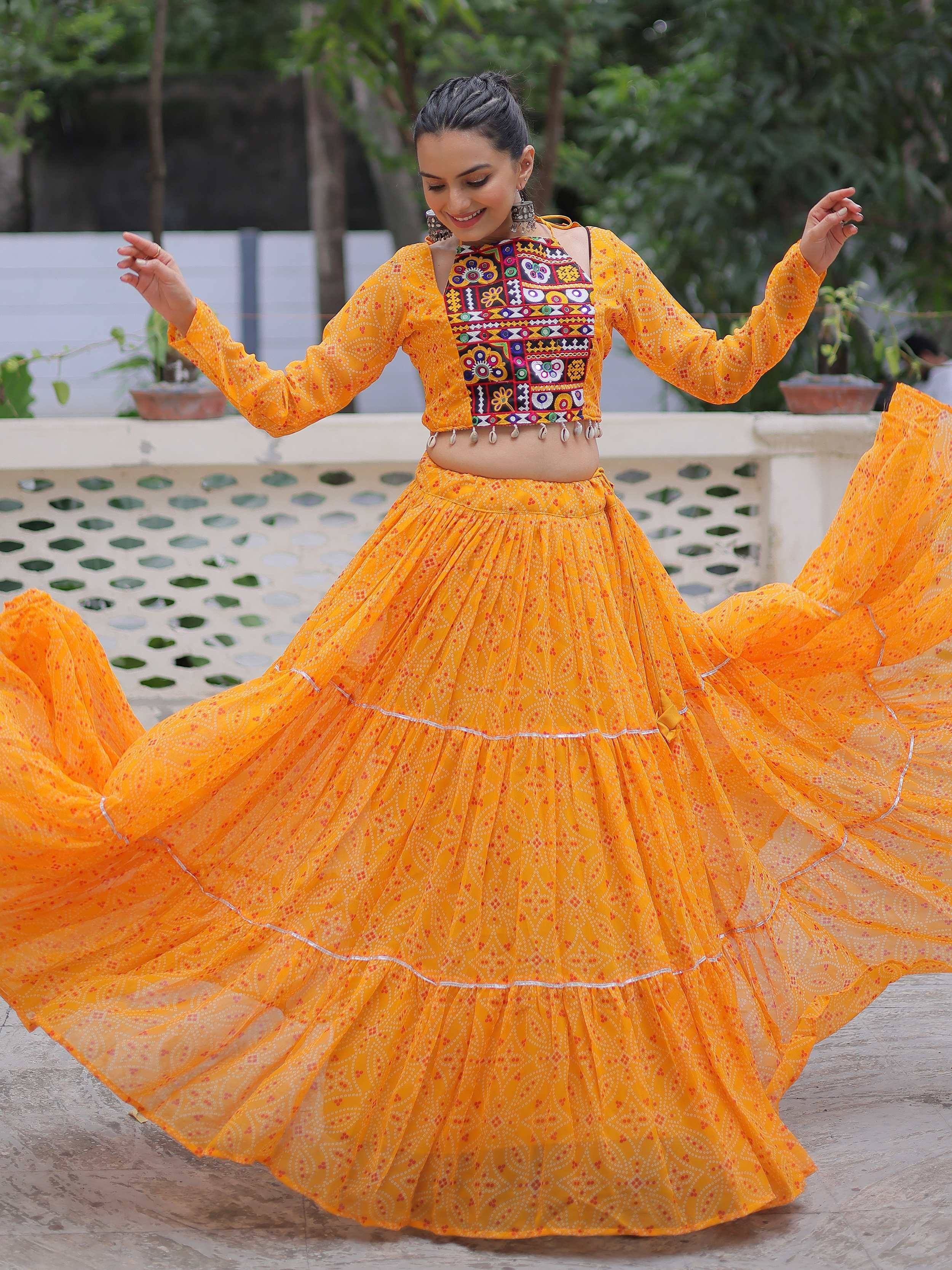 Vibrant yellow ethnic lehenga choli with embroidered crop top and flared skirt, perfect for festive occasions