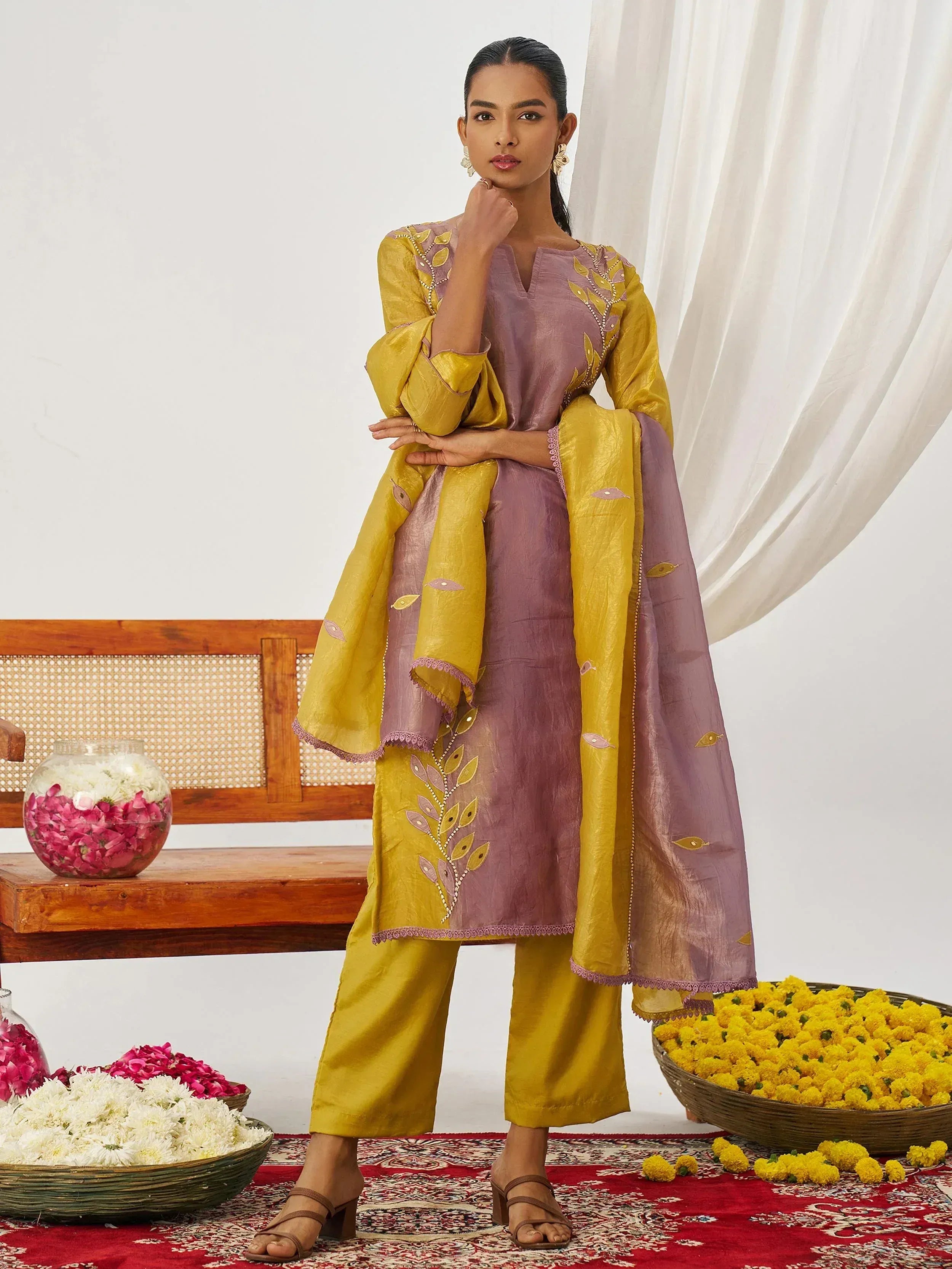 Elegant purple and mustard Indian salwar kameez with leaf embroidery, perfect for festive occasions