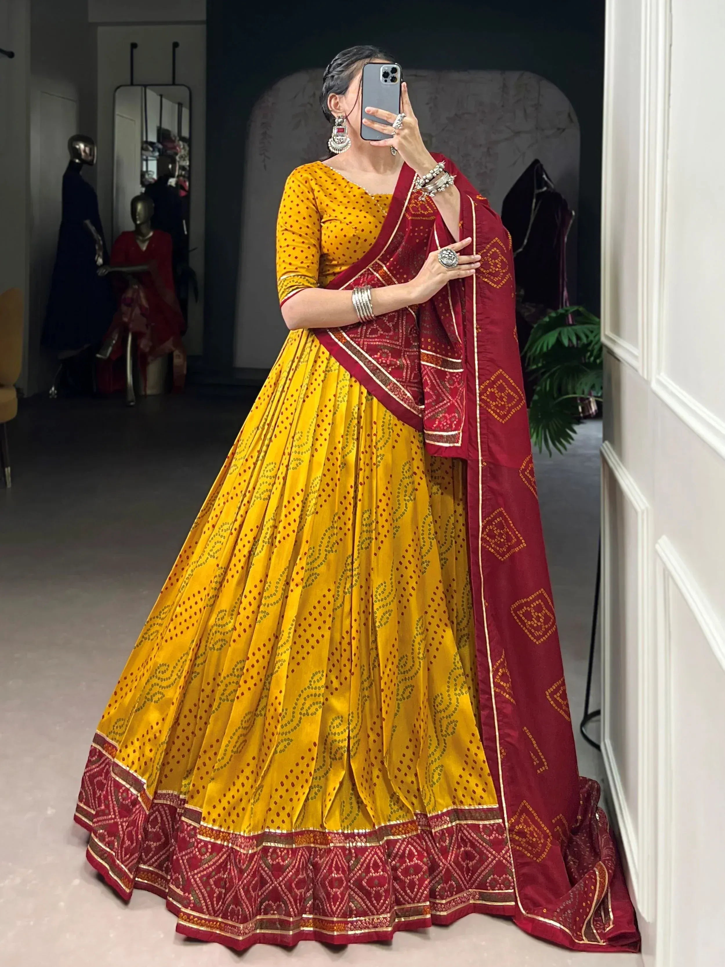 Yellow and maroon printed lehenga choli with ethnic embroidery, perfect for Indian weddings and festivals
