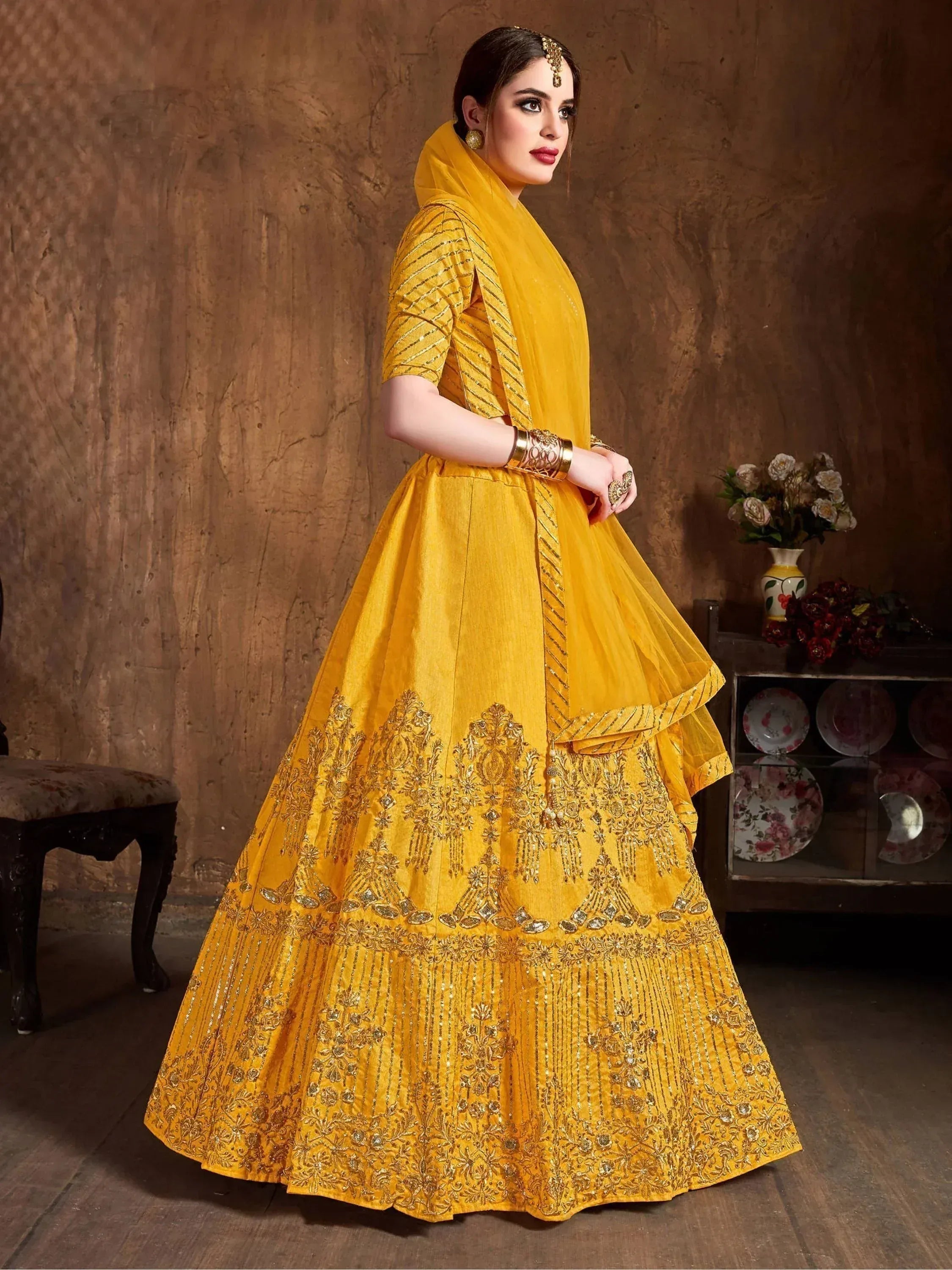 Yellow designer lehenga choli with gold embroidery, perfect for Indian ethnic wear occasions