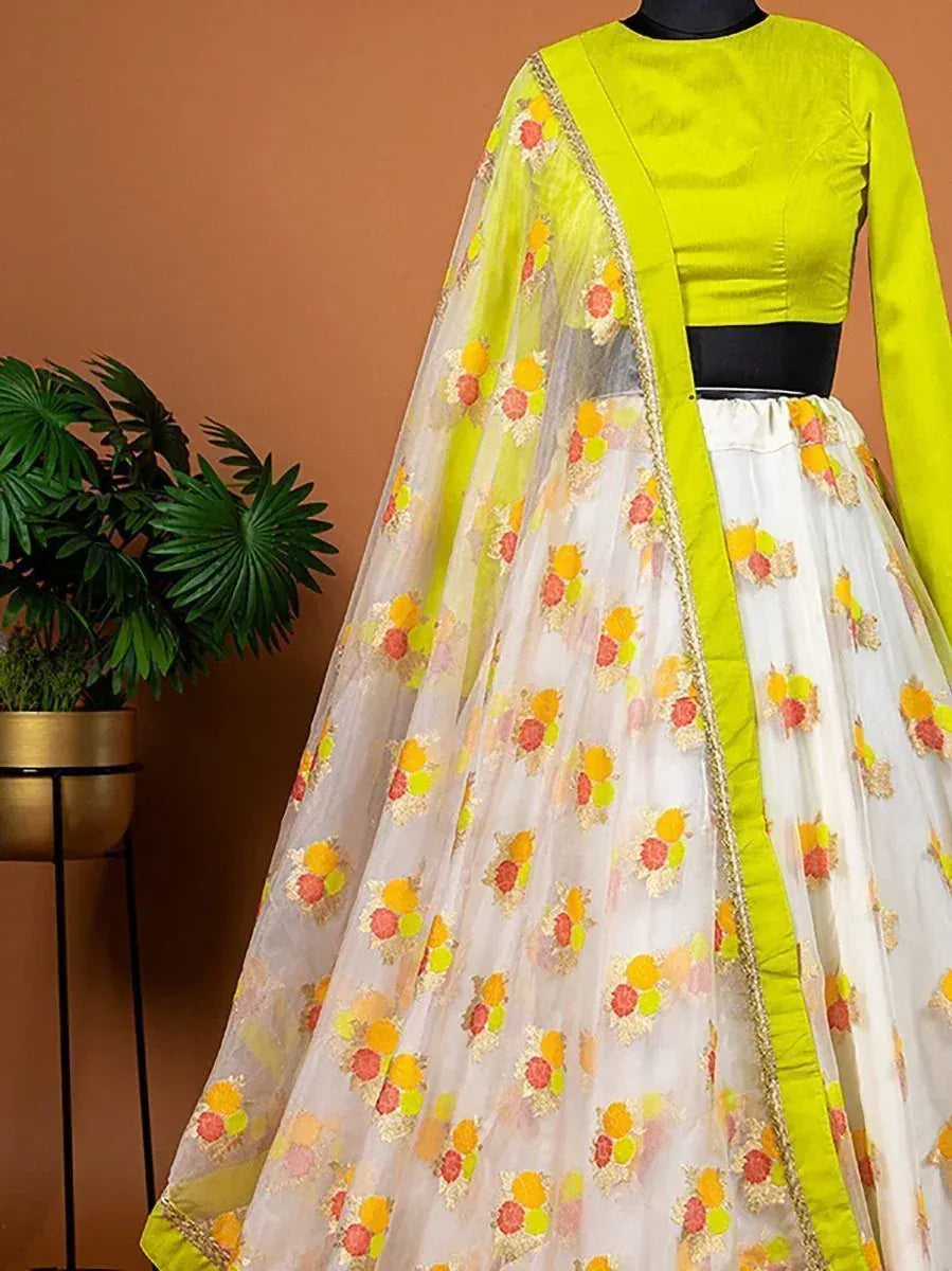 Vibrant lime green and white floral lehenga choli with sheer dupatta, perfect for Indian ethnic occasions.