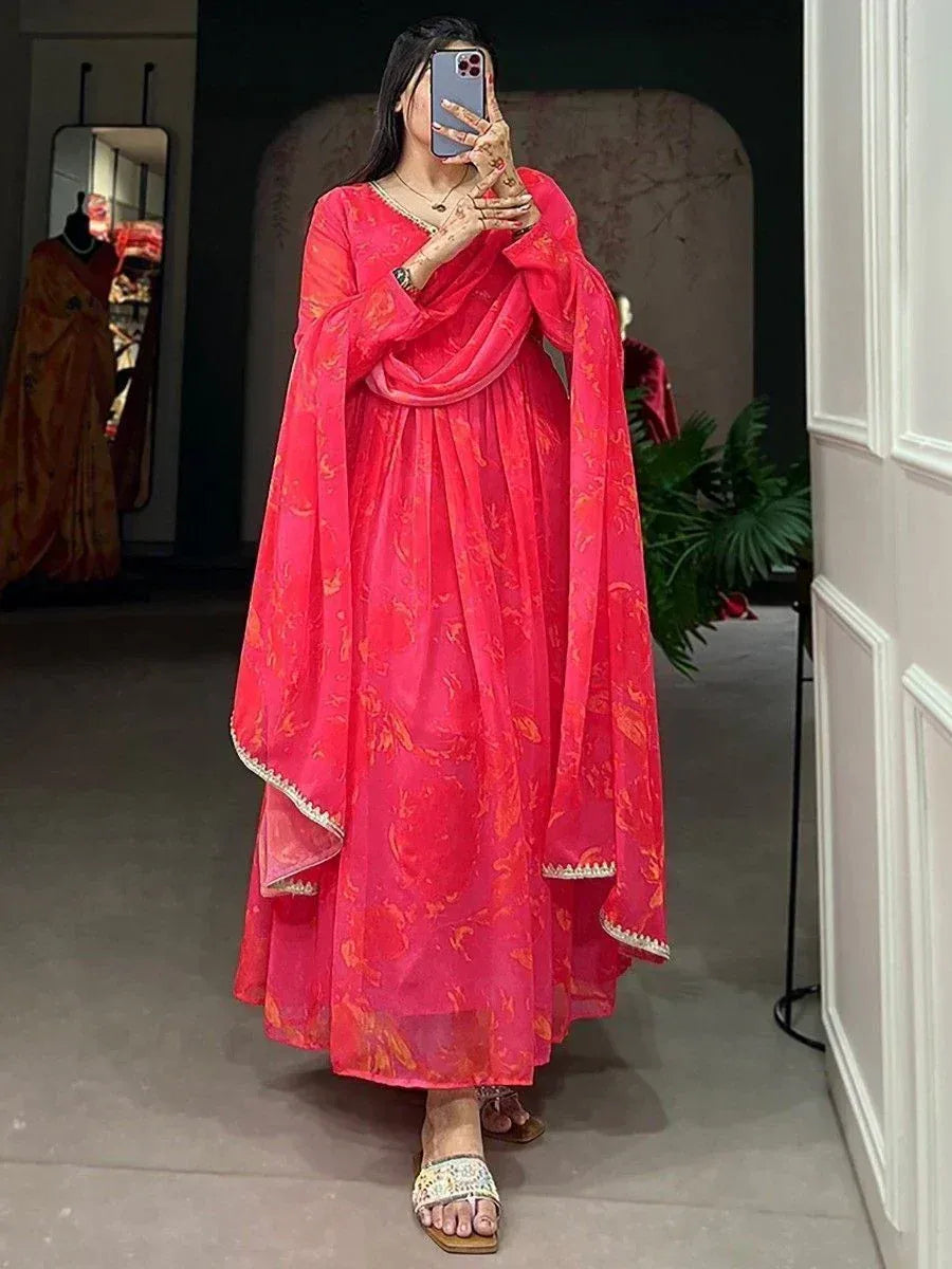 Vibrant pink floral printed ethnic gown with dupatta, perfect for Indian occasions and festive wear.