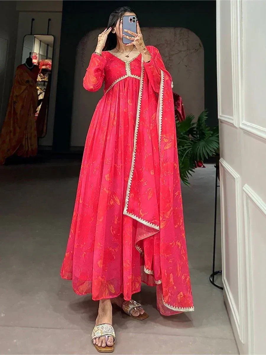 Pink floral ethnic gown with gold trim, perfect for Indian occasions and festive wear