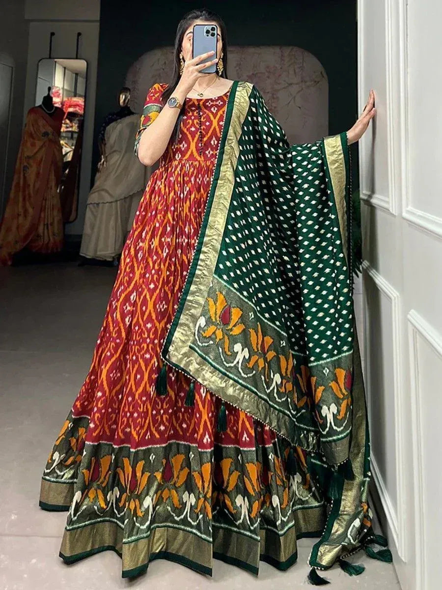 Red and green ikat print ethnic gown with matching dupatta, perfect for Indian occasions