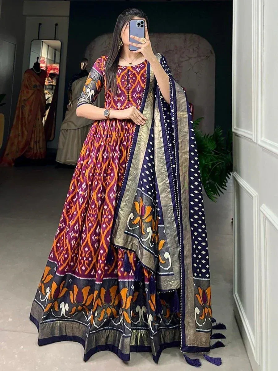 Woman in vibrant purple and orange printed anarkali with matching dupatta, ethnic Indian wear