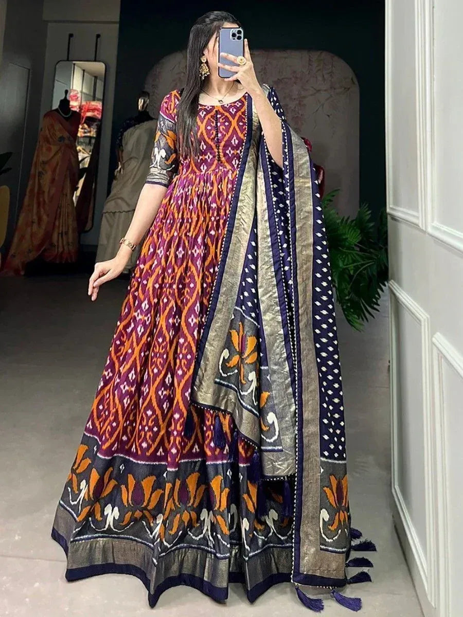 Woman wearing vibrant Indian ethnic anarkali gown with ikat print and dupatta, perfect for festive occasions