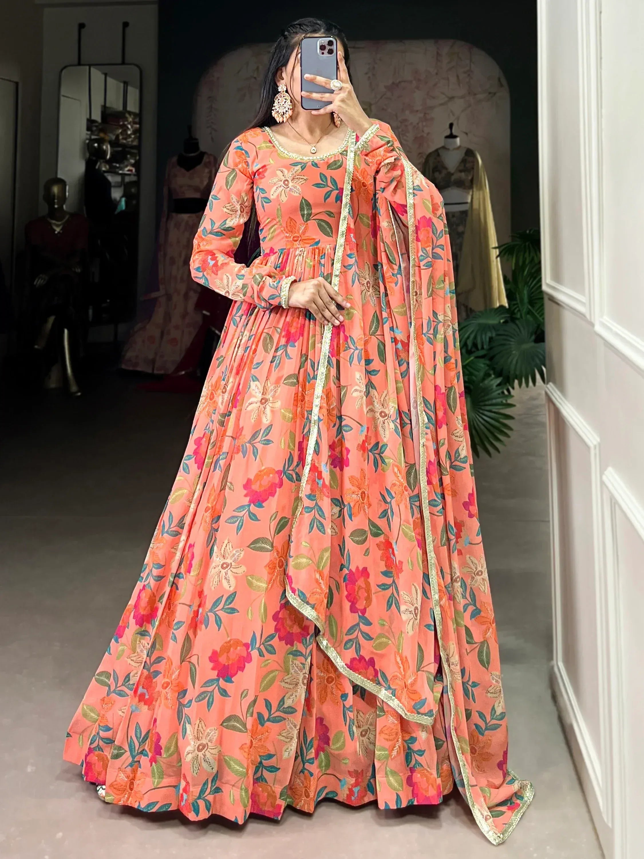 Peach floral printed anarkali gown with gold trim, perfect for Indian ethnic occasions and festive wear.