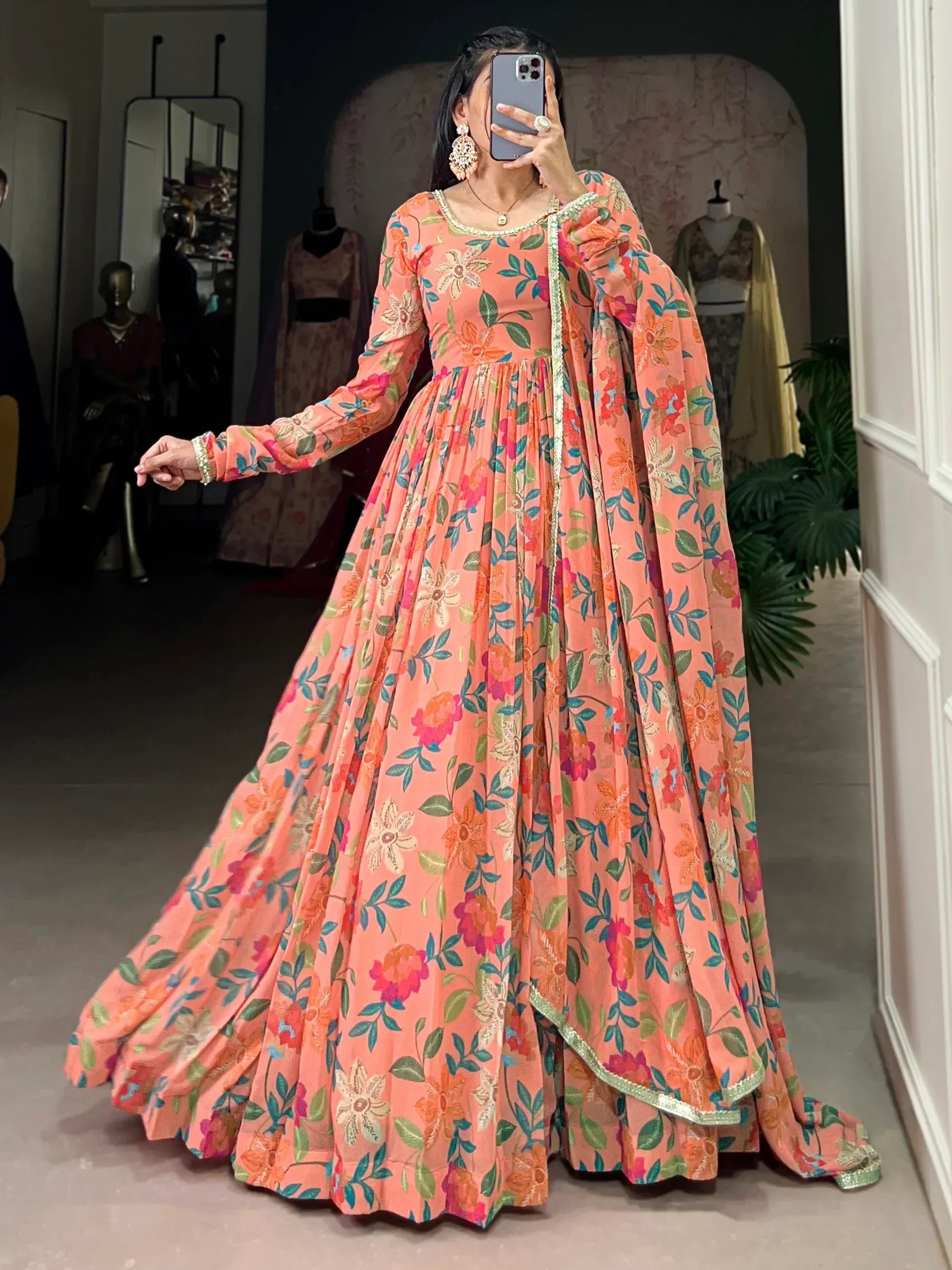 Peach floral anarkali gown with long sleeves and embroidered neckline, perfect for Indian ethnic occasions