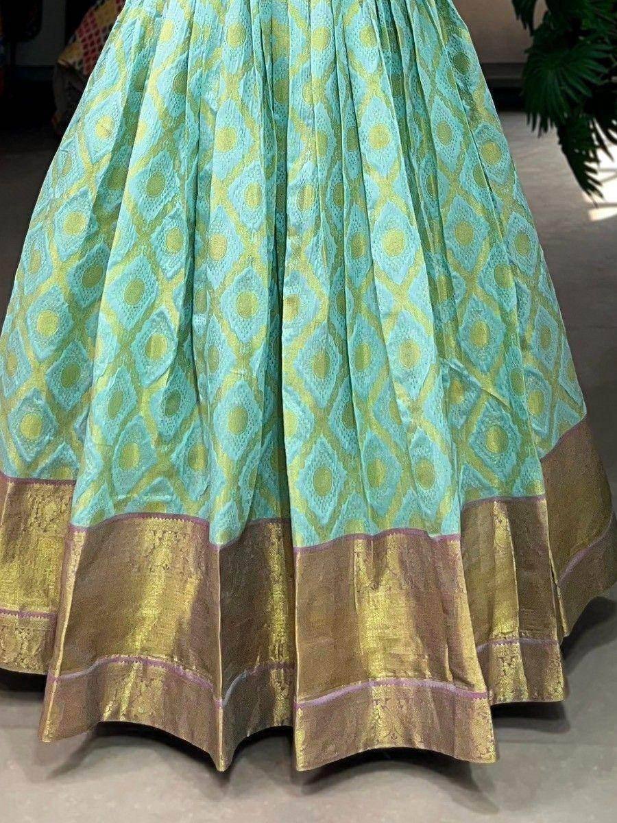 Turquoise and gold ethnic lehenga skirt with geometric print and brocade border