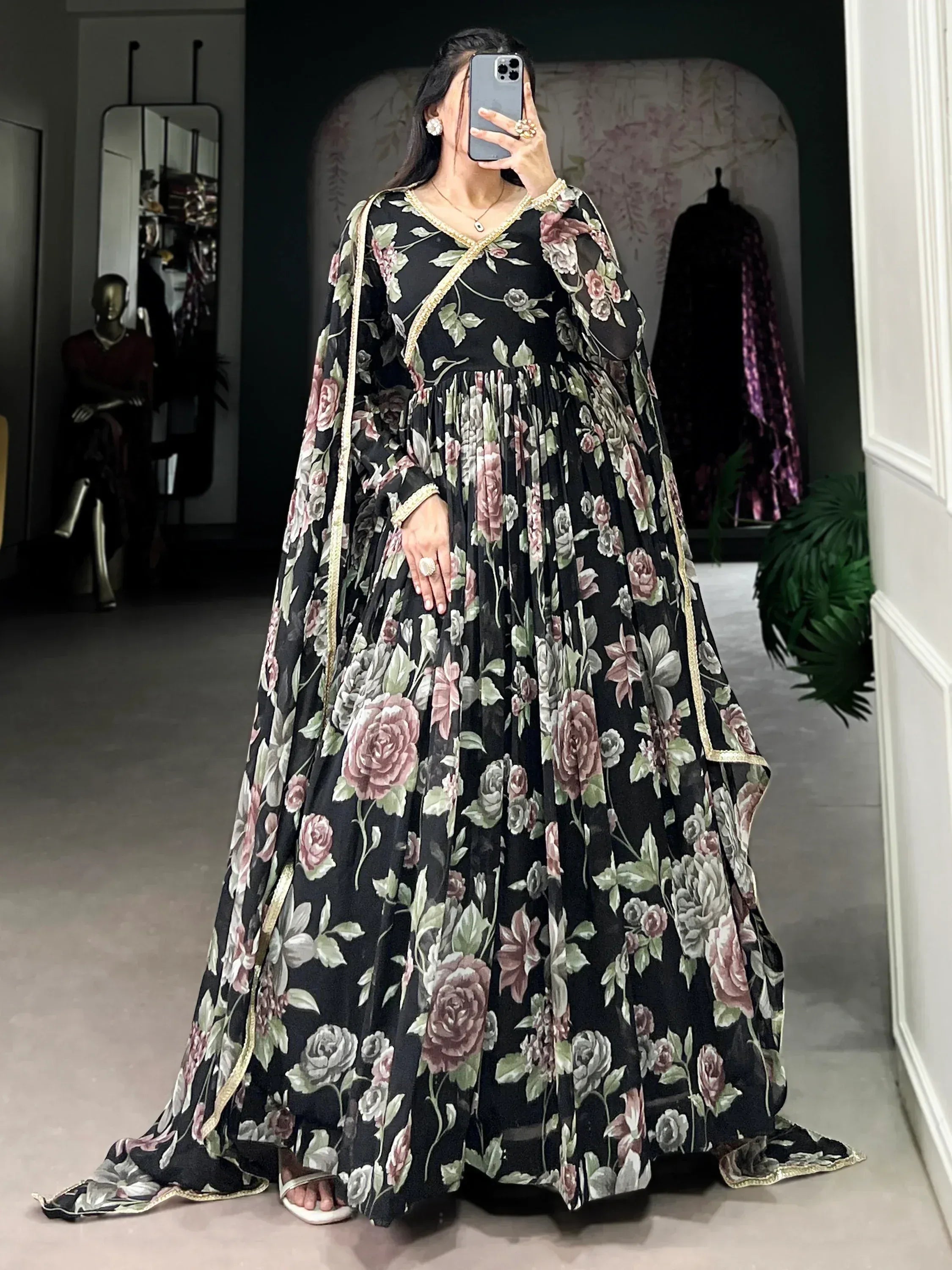 Black floral print ethnic gown with gold trim, perfect for Indian occasions and festive wear