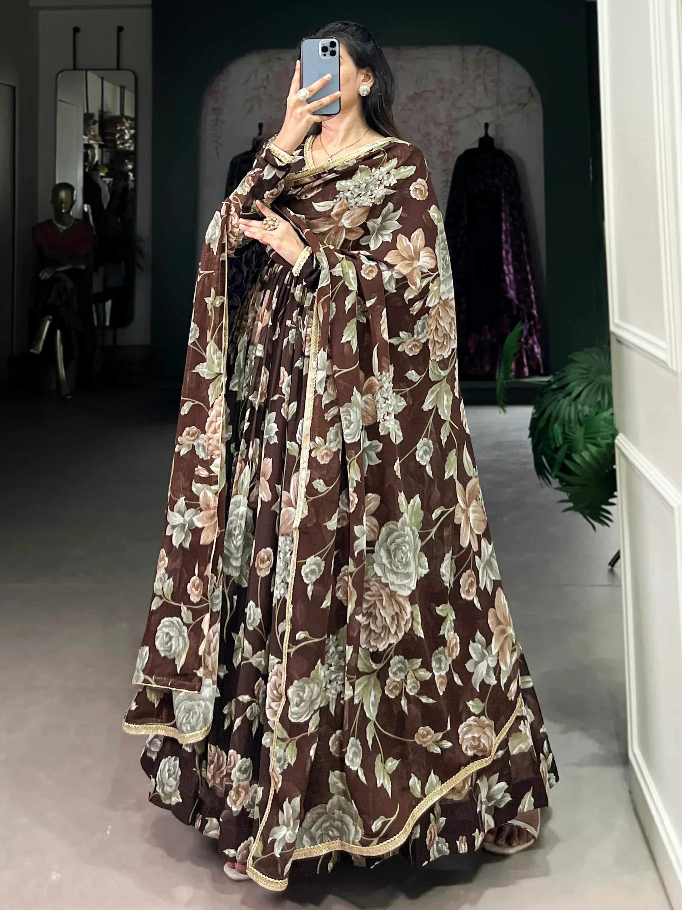 Brown floral print Indian ethnic gown with gold trim, perfect for festive occasions