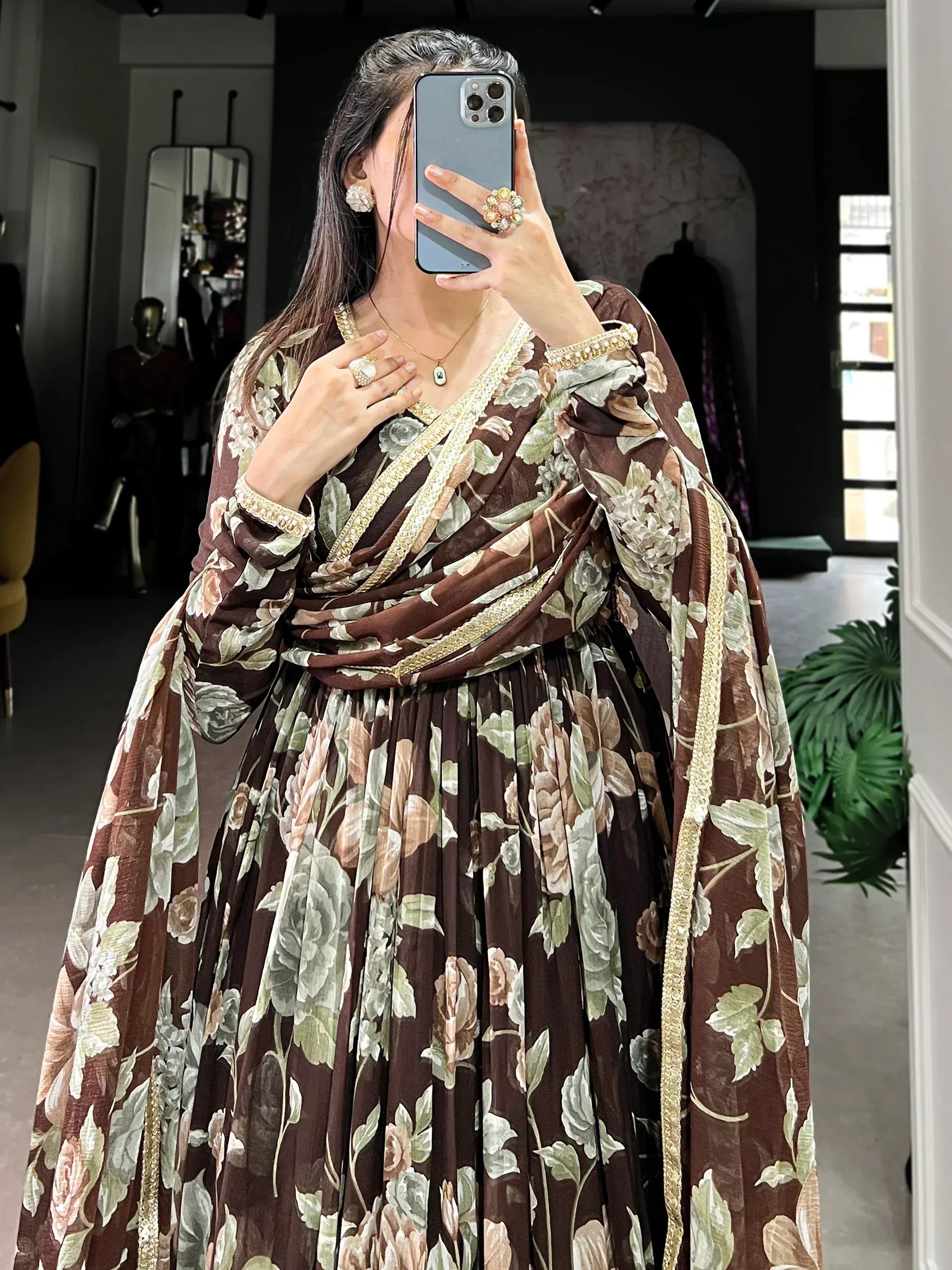 Brown floral ethnic gown with gold trim, perfect for Indian occasions and festive wear.