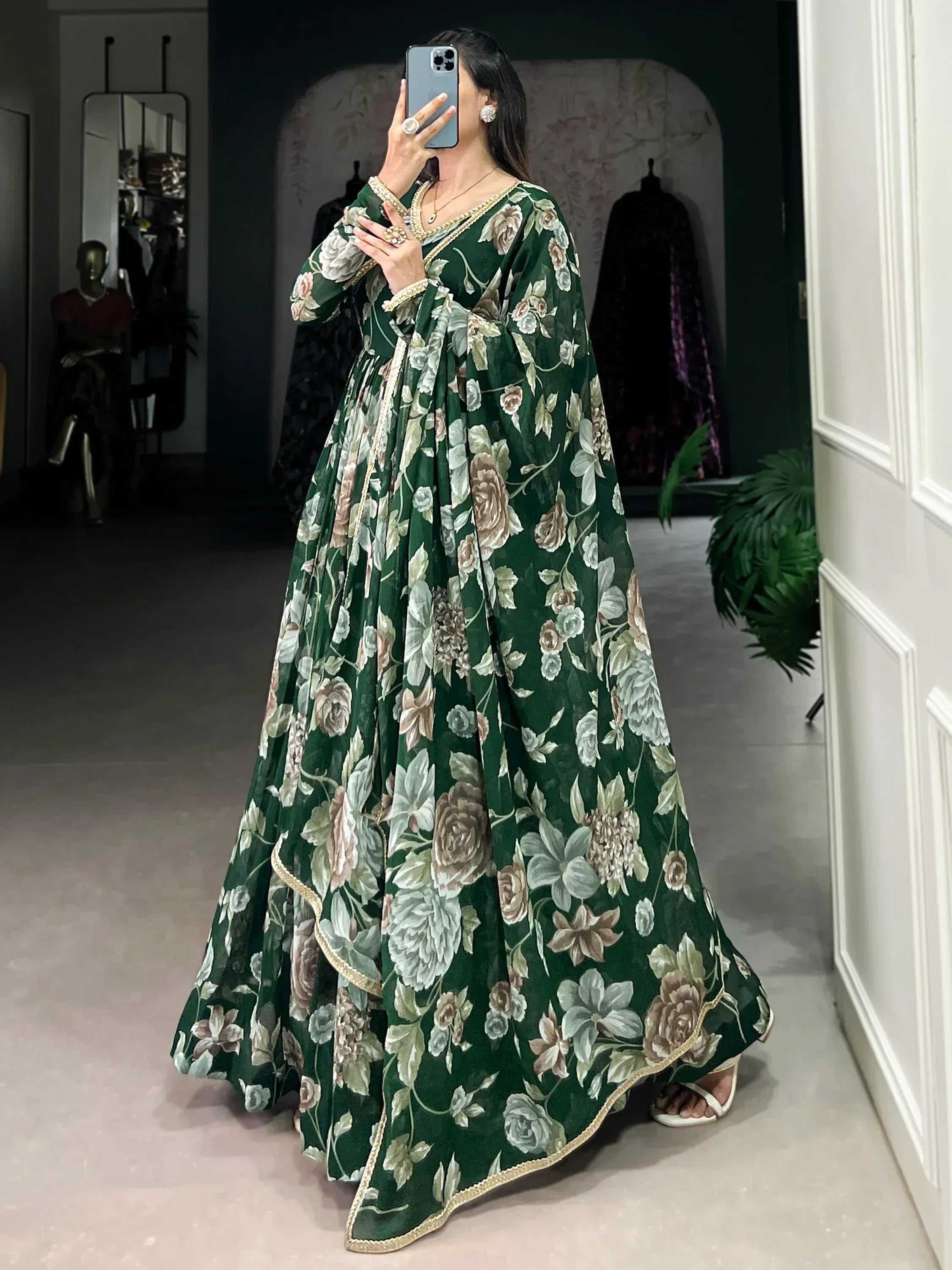 Woman wearing green floral printed ethnic gown with long sleeves and dupatta