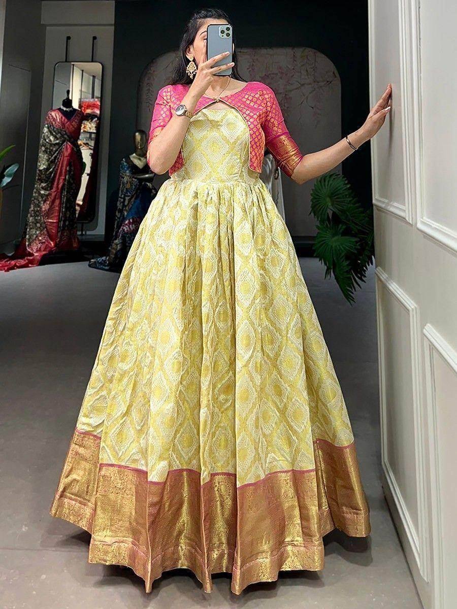 Yellow printed ethnic gown with pink dupatta, perfect for Indian weddings and festive occasions