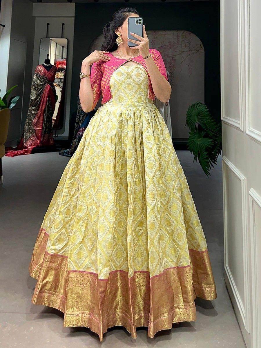 Yellow printed ethnic gown with pink dupatta, perfect for Indian weddings and festive occasions