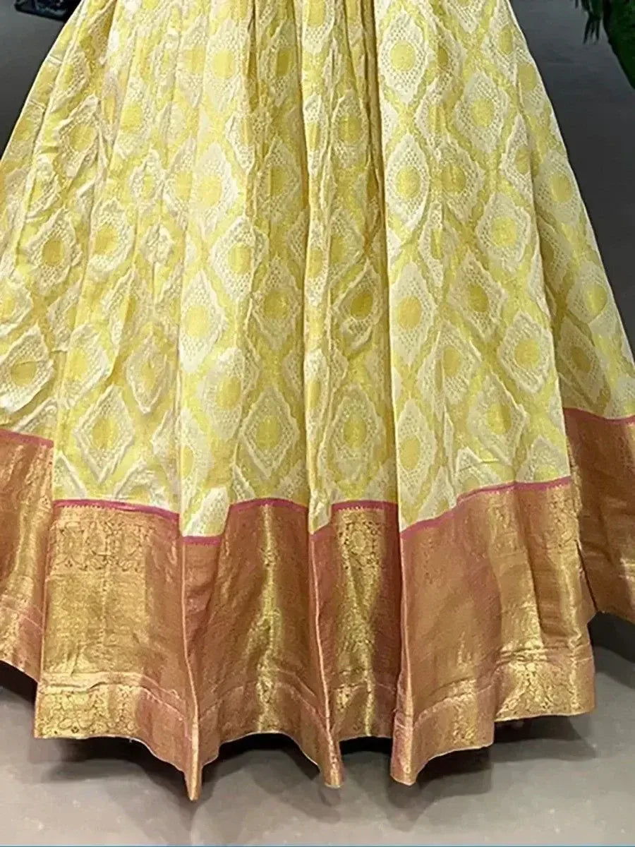 Yellow and gold ethnic lehenga skirt with diamond pattern and brocade border