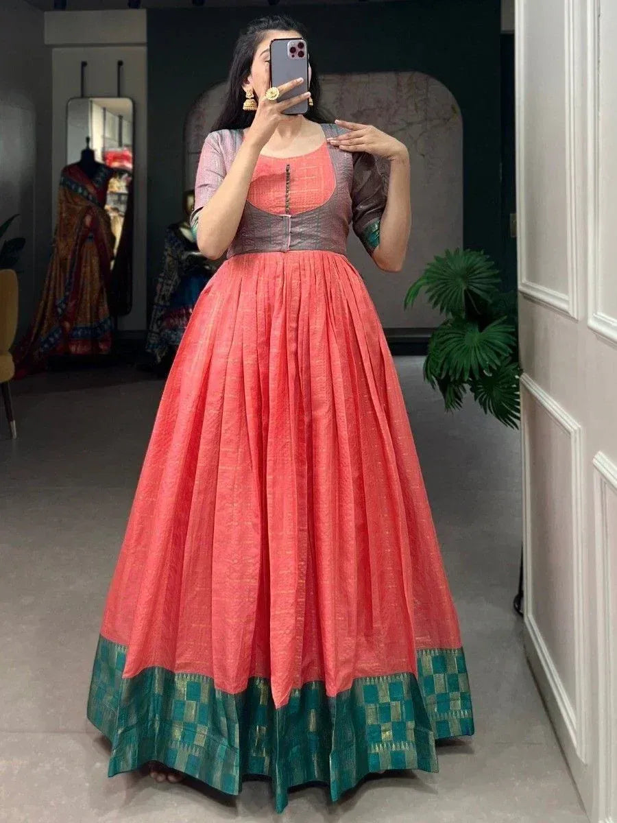 Coral ethnic gown with green border, perfect for Indian weddings and festive occasions