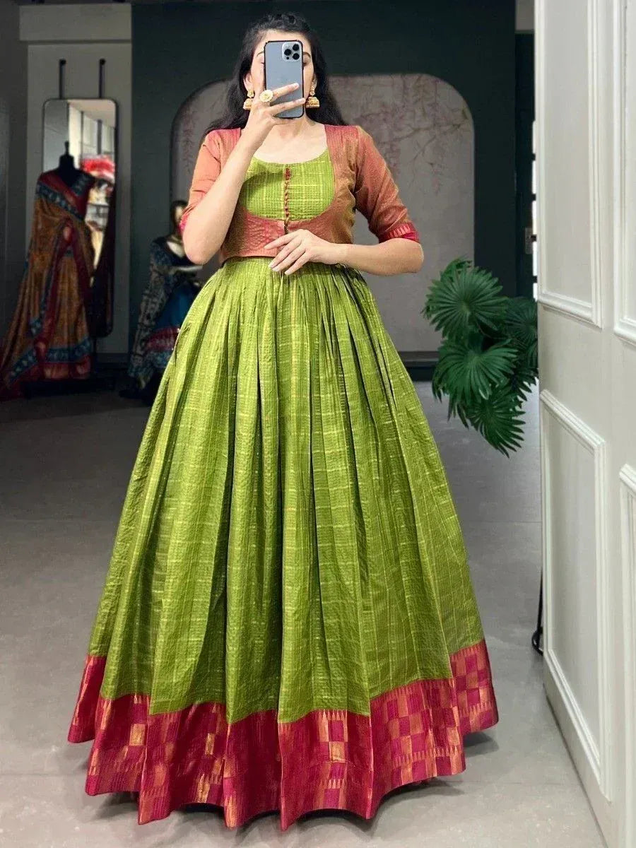 Green and red ethnic lehenga choli with pleated skirt, perfect for Indian weddings and festivals