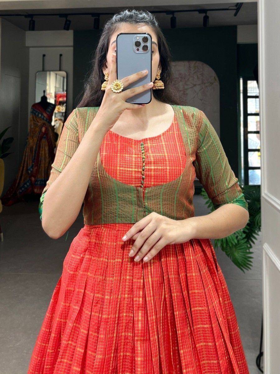Red and green ethnic gown with pleated skirt, perfect for Indian festive occasions