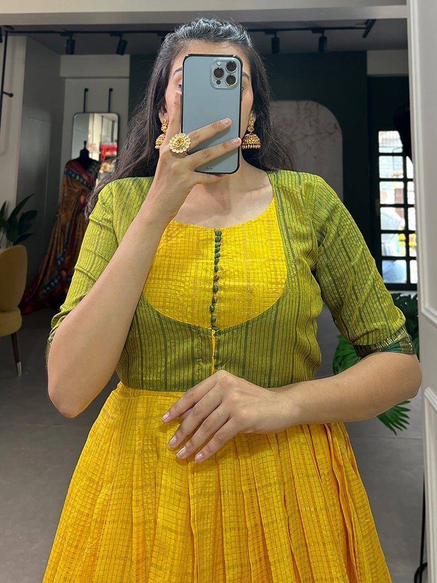 Yellow and green ethnic gown with pleated skirt, perfect for Indian occasions and festive wear
