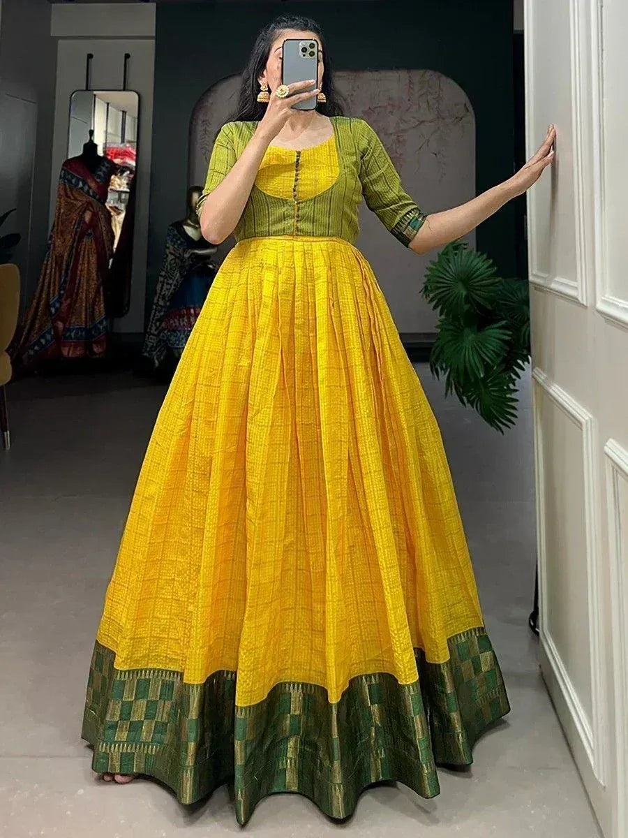 Vibrant yellow and green ethnic gown with pleated skirt, perfect for Indian festive occasions