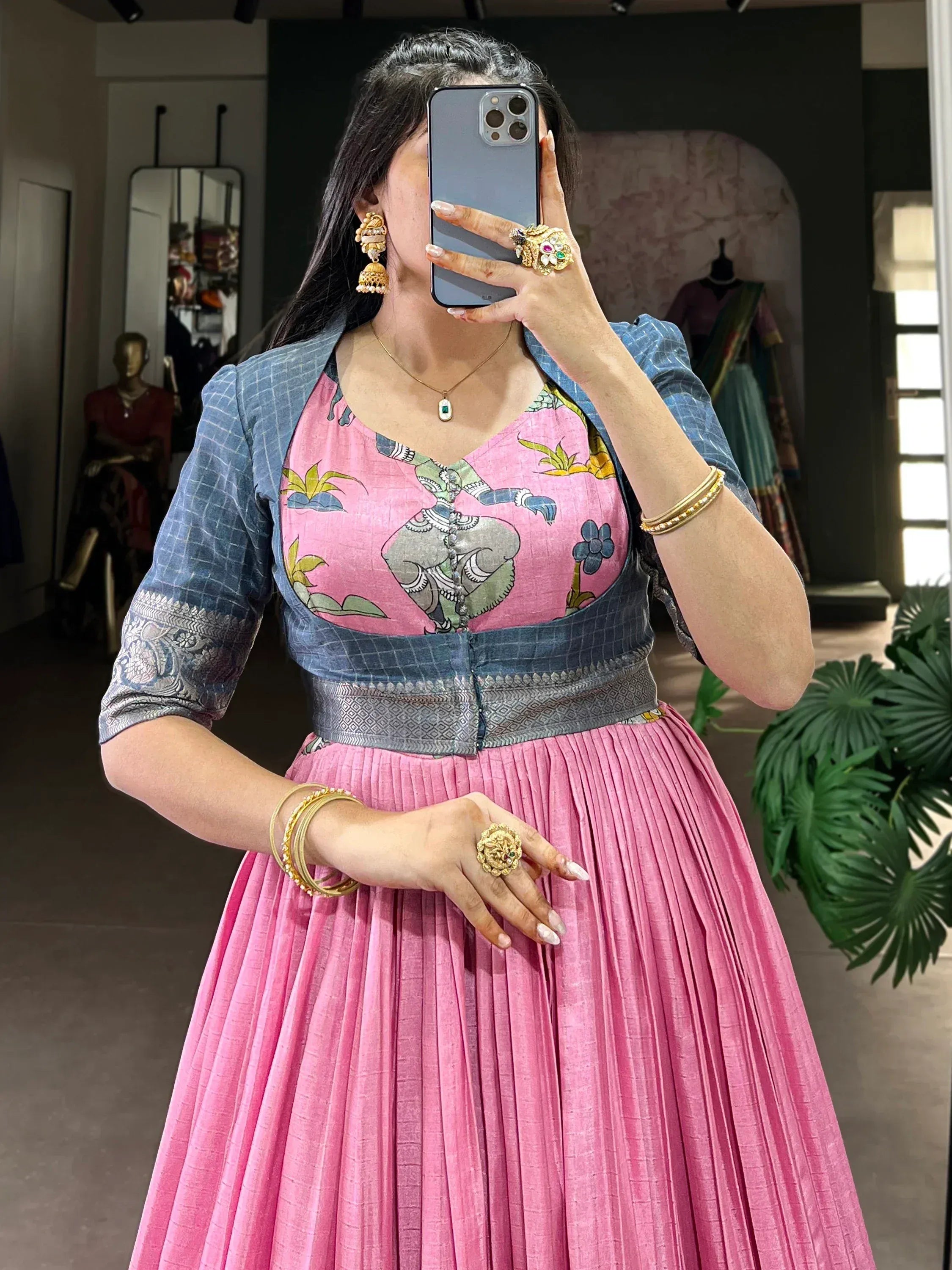 Pink pleated lehenga with printed blouse and blue jacket, traditional Indian ethnic wear